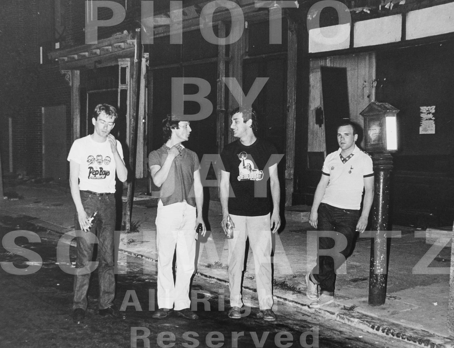 Gang of Four, standing near the Hot Club on the Southeast corner of 21st and South Streets after their first U.S. concert, 8/17/79 by Jay Schwartz