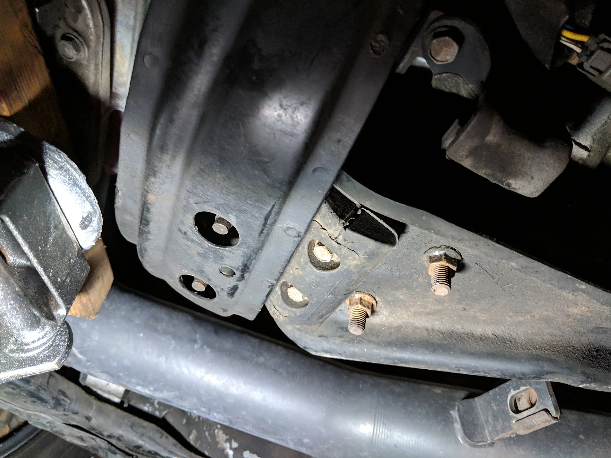 The two lowest bolts towards the right of the image.
