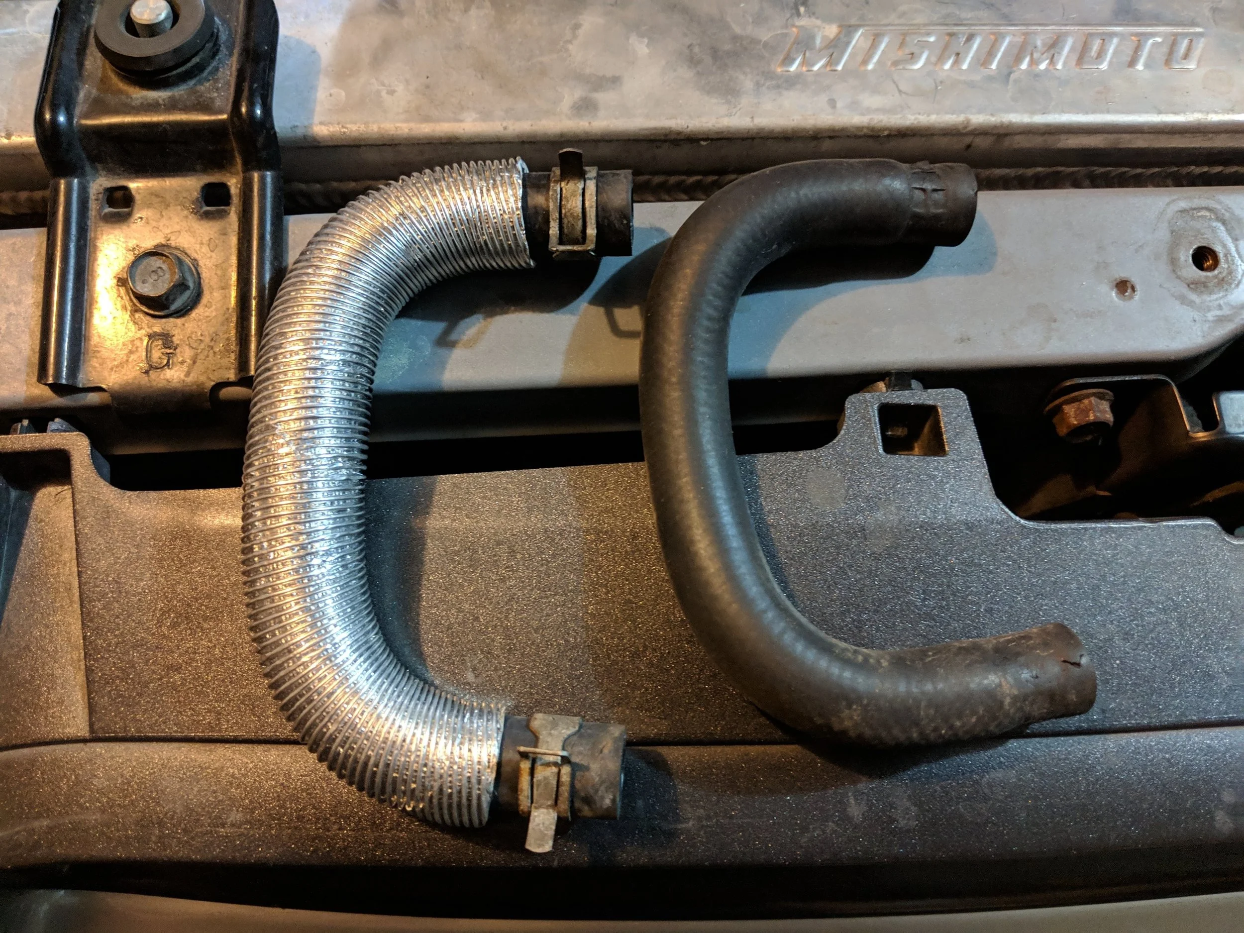 C shaped coolant hose. New and old. Subaru coolant hose