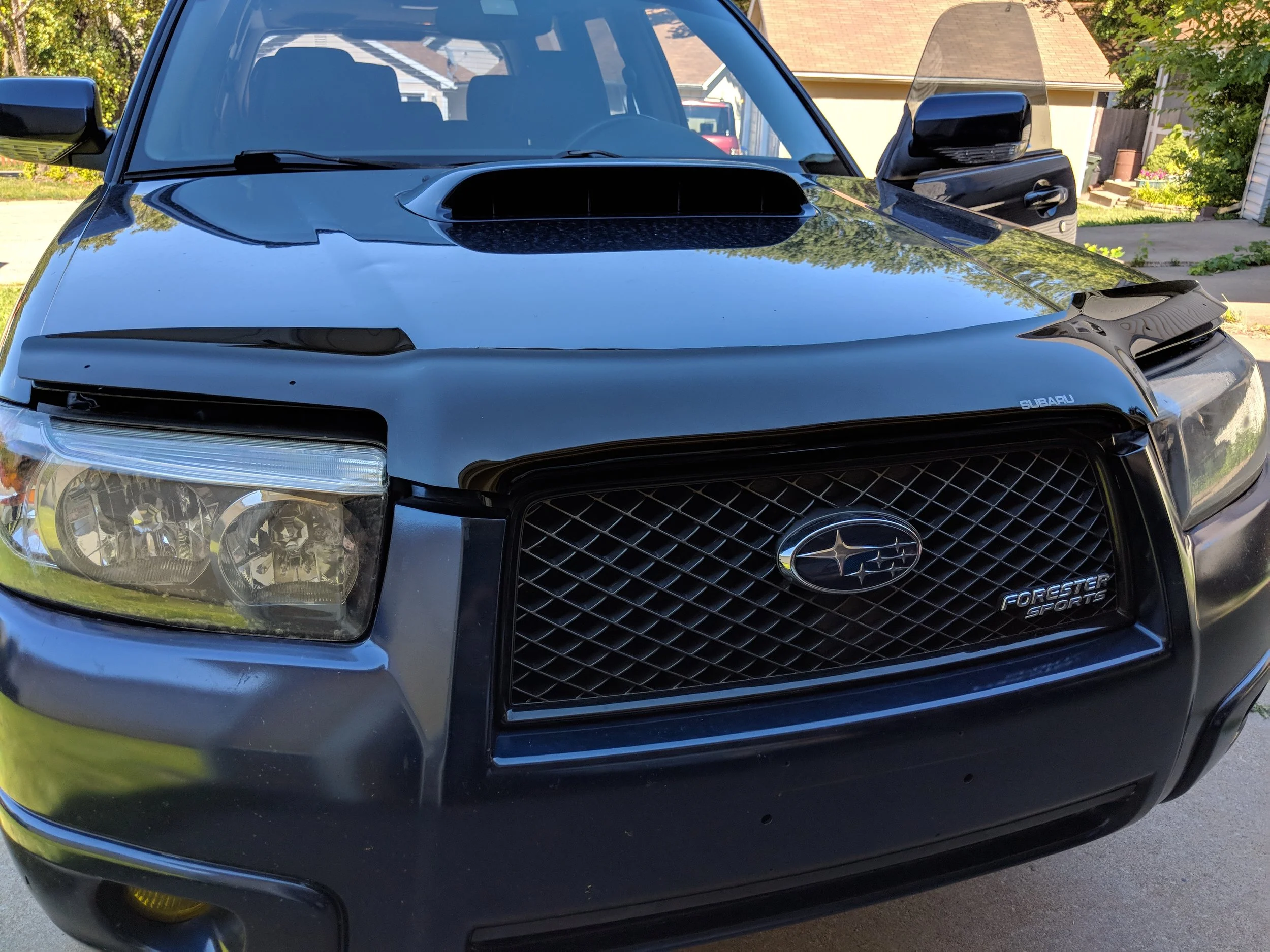 Hood popped and ready to get to work. My installed headlights are Depo sport headlights 07-08 (Blacked out housing)