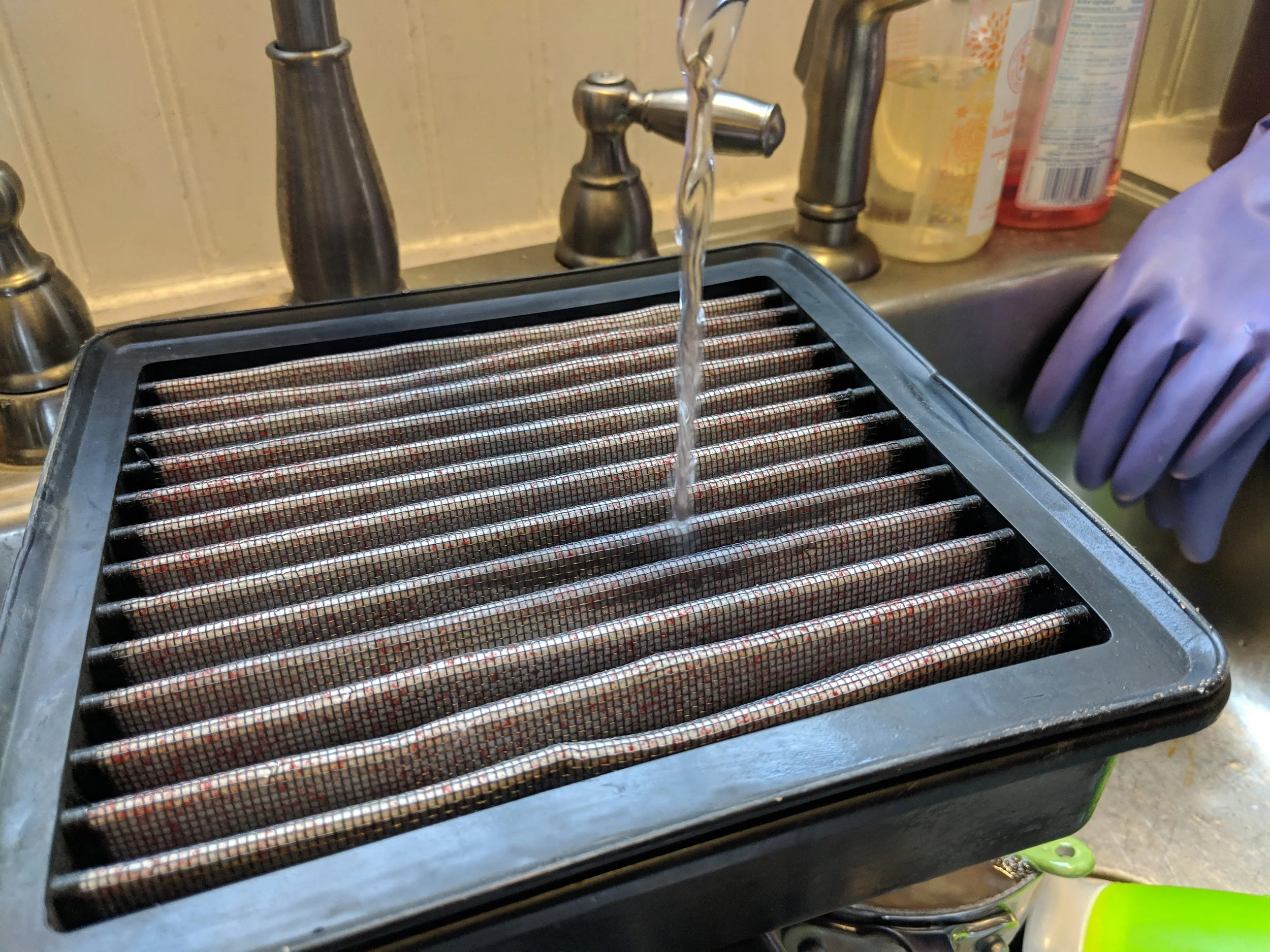 Hanging out among the dishes. The water should flow from the clean side (closer to the throttle body) to the outside (where all the dirt gets filtered on).