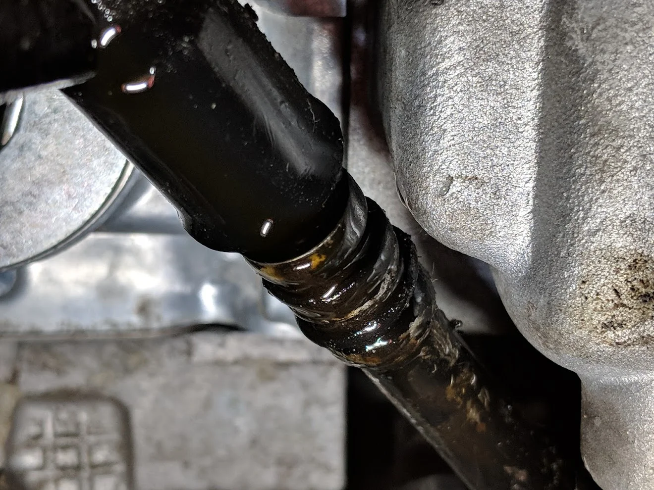 Removing the factory dipstick tube.