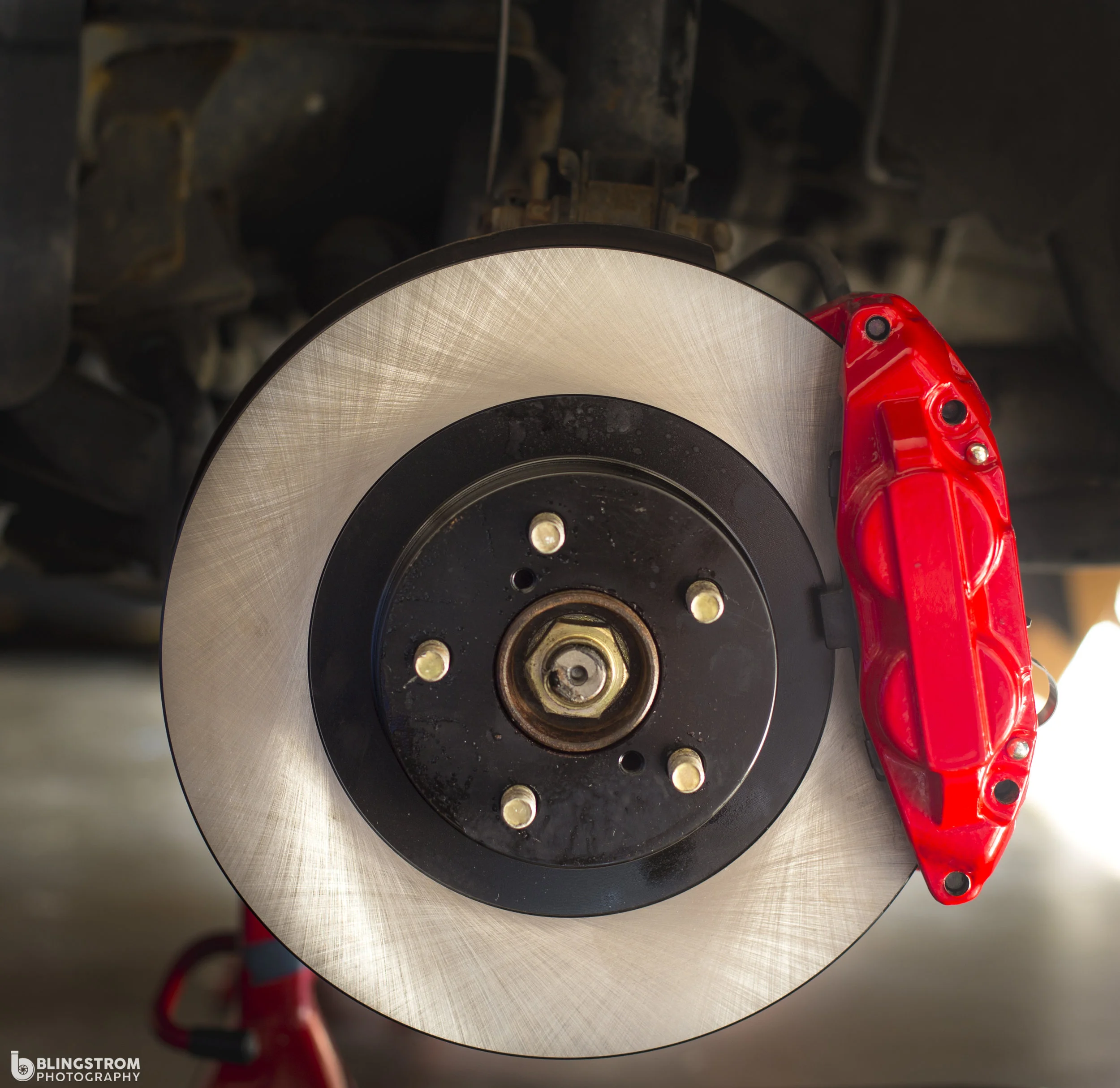 Shiny and new! This is the moment you have been waiting for. new rotors and caliper making their home.
