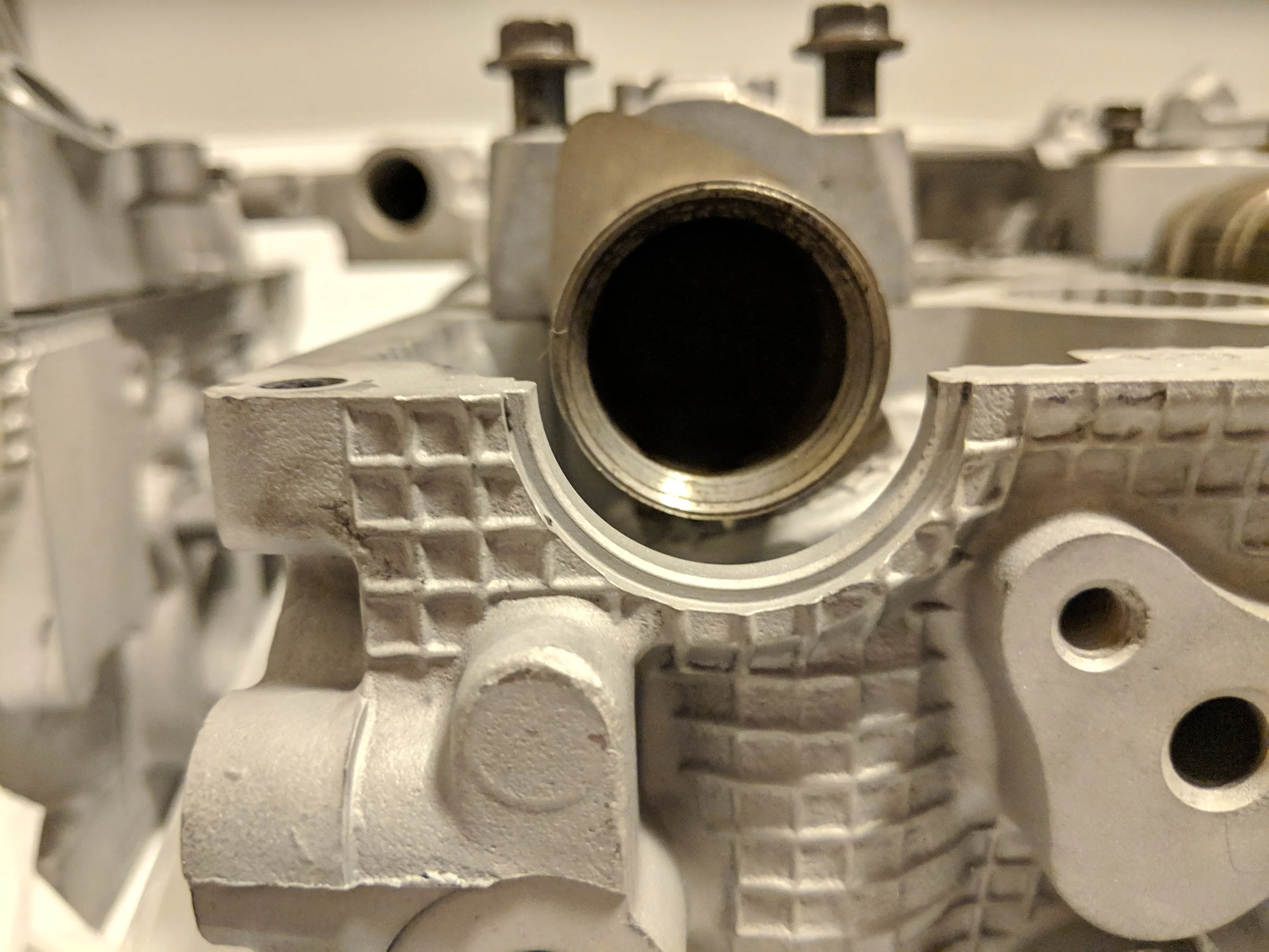 Here is the hole and you need something to fill it… Without half moon seals your engine oil won;t think twice before exiting.