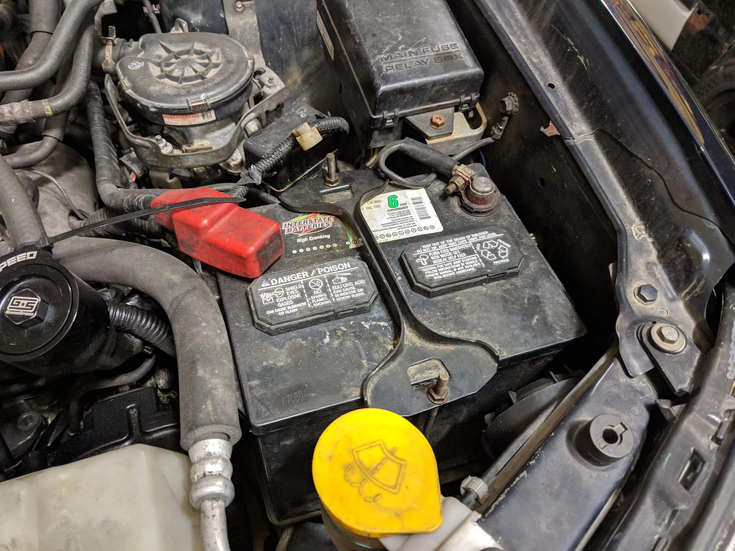 The battery is the first victim to our rampage of removal. The air pump is just behind it.