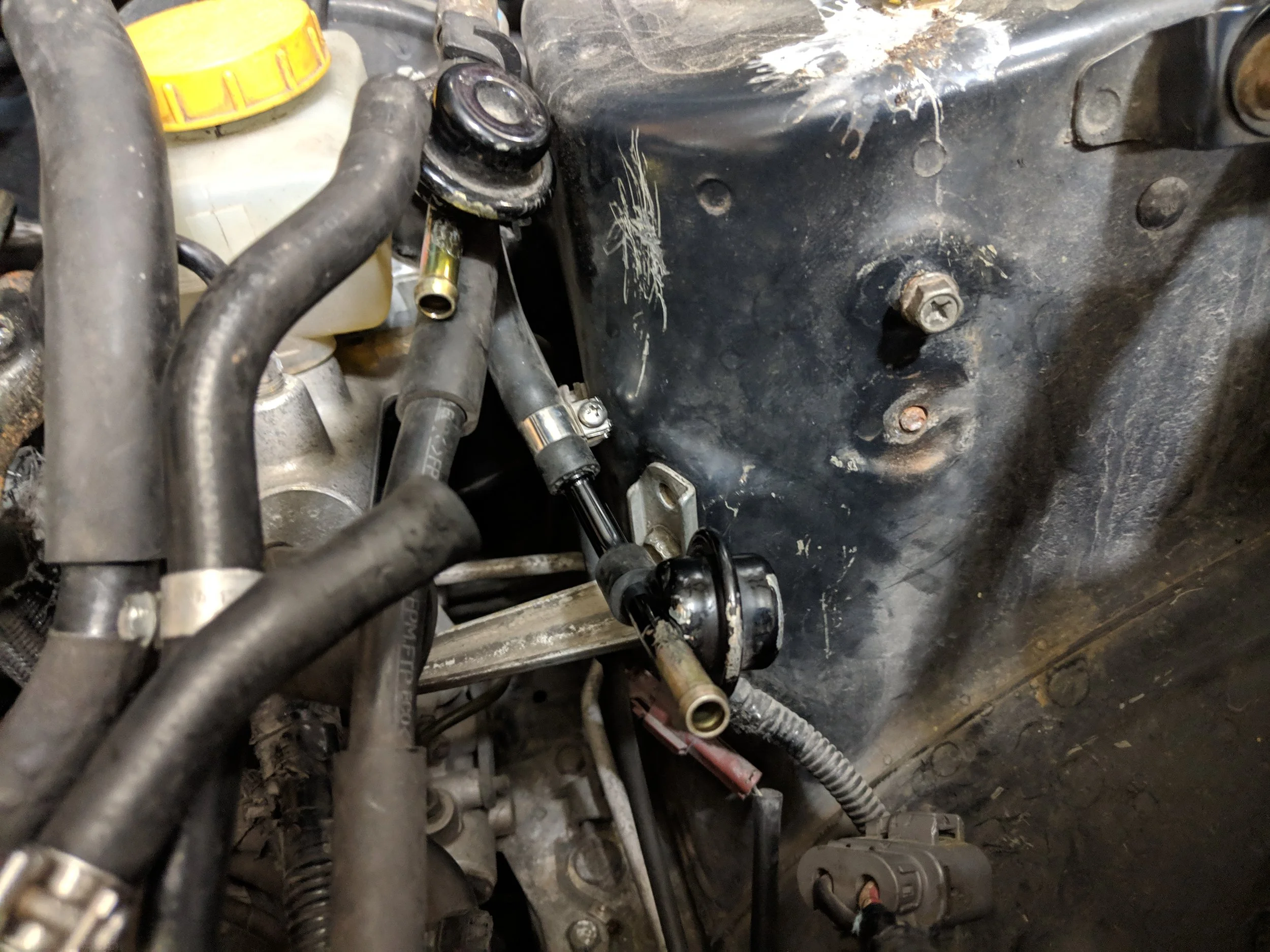 With the air pump removed you can now undo the fuel line clamps and hoses. Or you can used the fuel line tool to unclip them from the hardlines.
