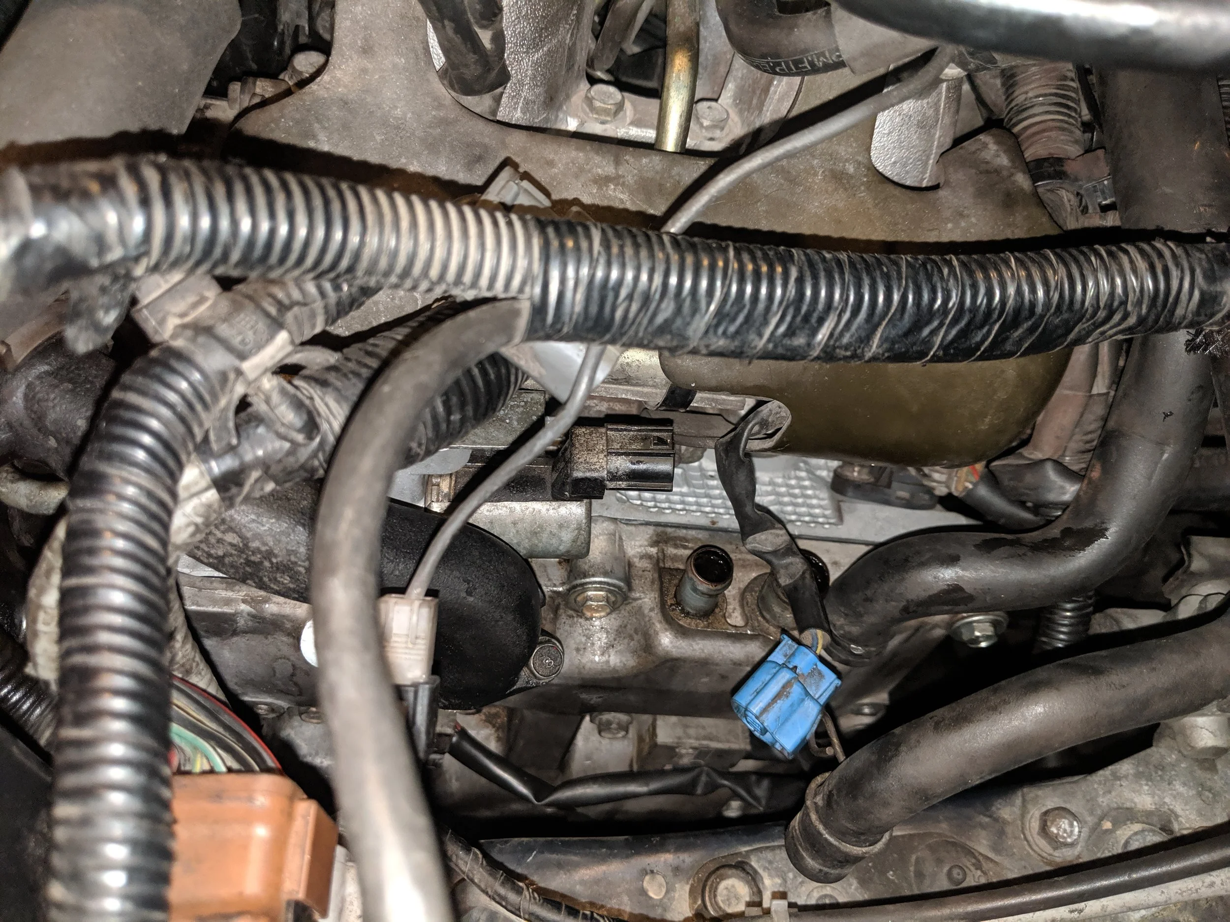 Move to the driver’s side and release the ocv connection and driver’s side cam sensor connection.
