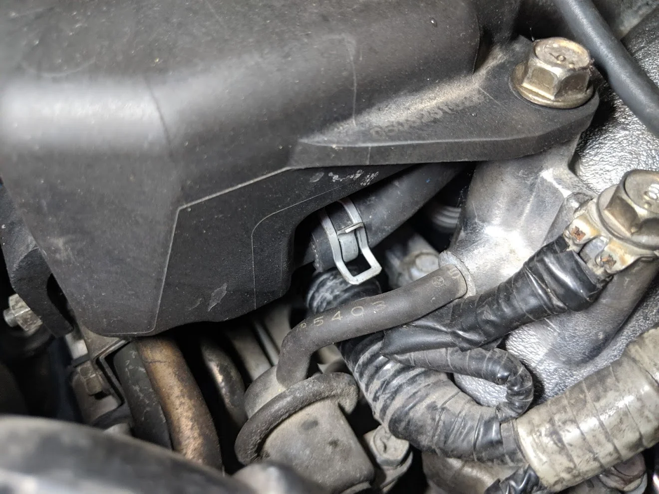 Close up of the upper coolant hose to remove.