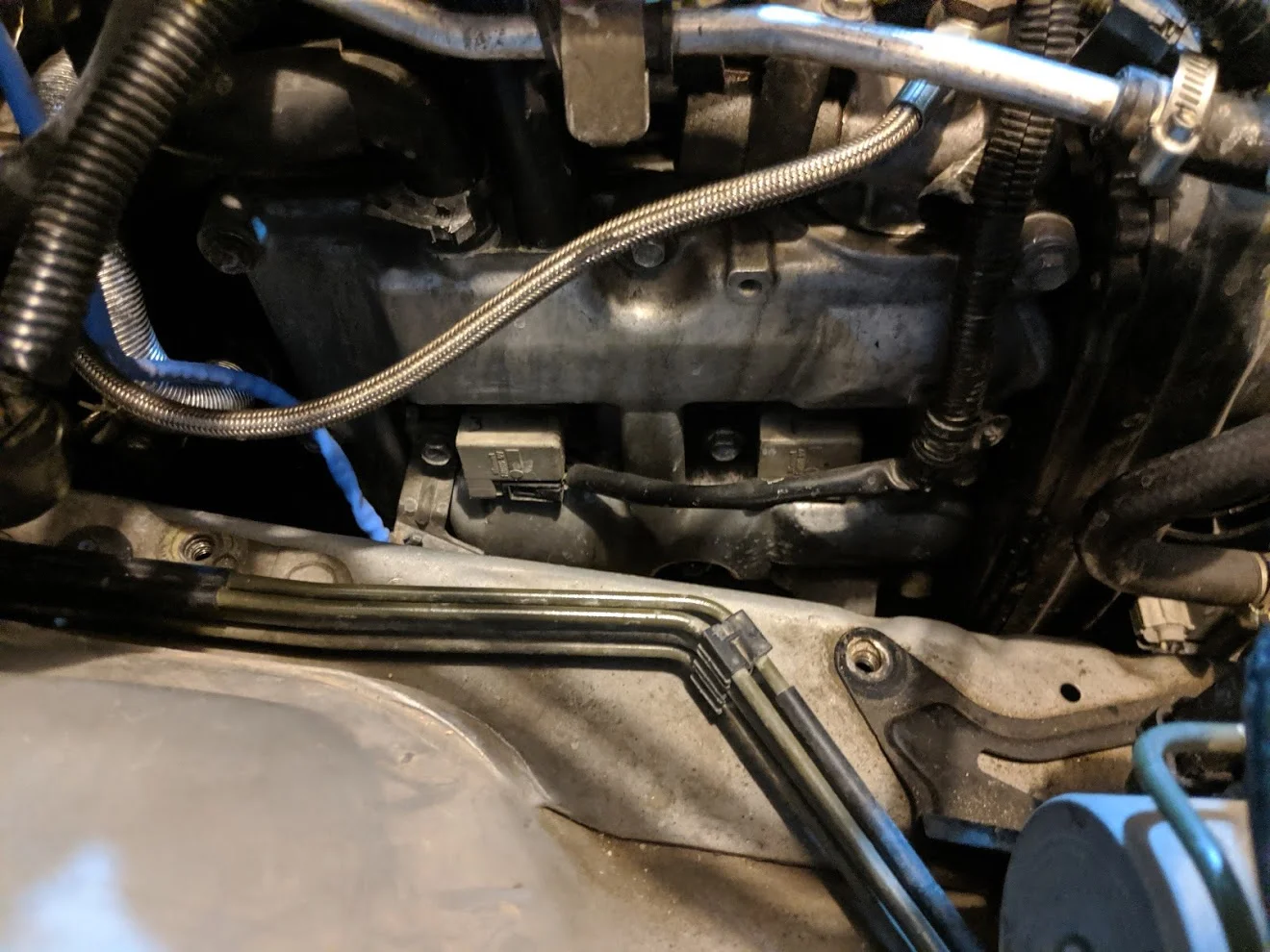 Undo the two coil pack connections to further release the wiring