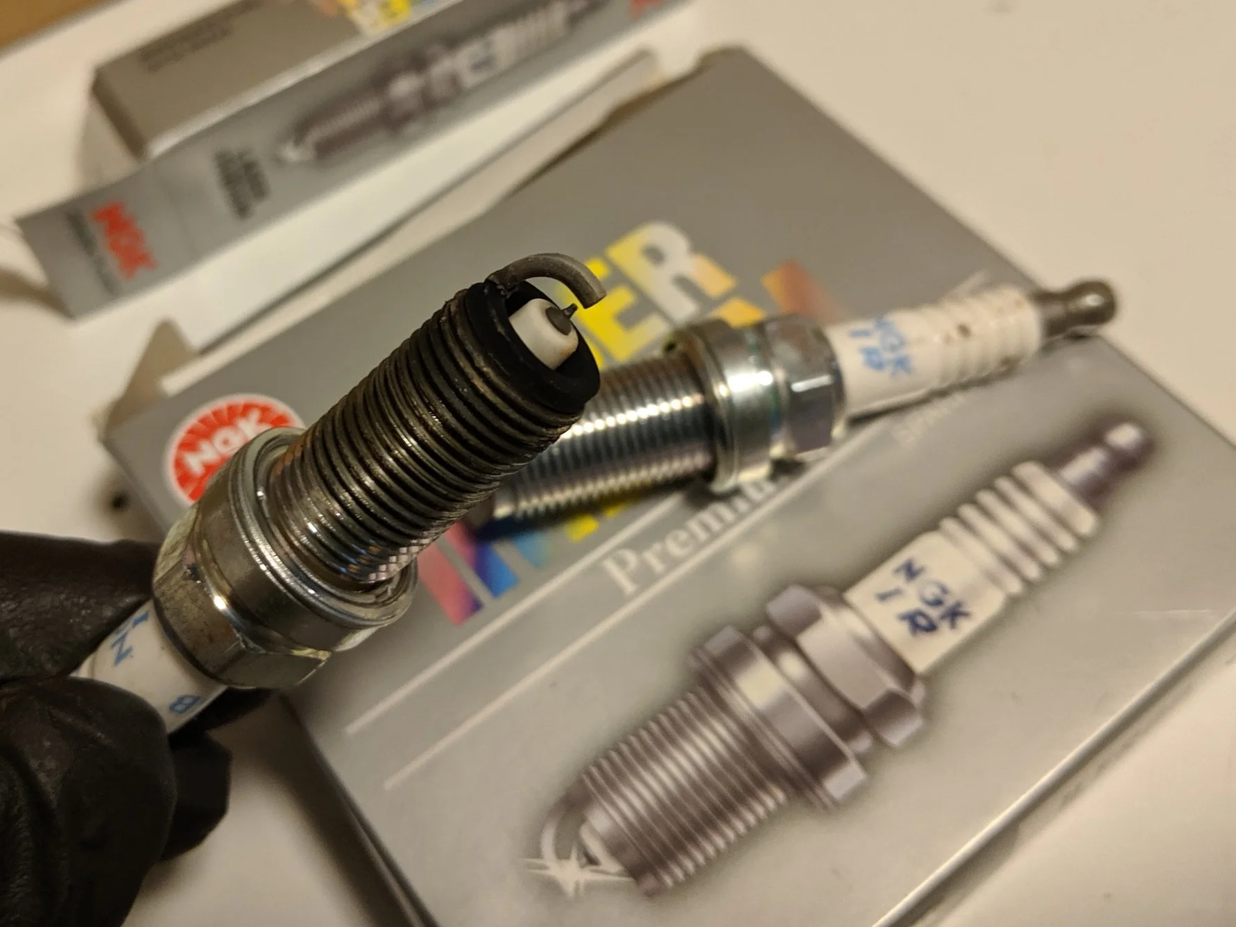 Good looking plug! Nice tan area on the electrode and a bit of carbon on the threads and surrounding area. NGK ILFFR6B 6481 Iridium spark plugs