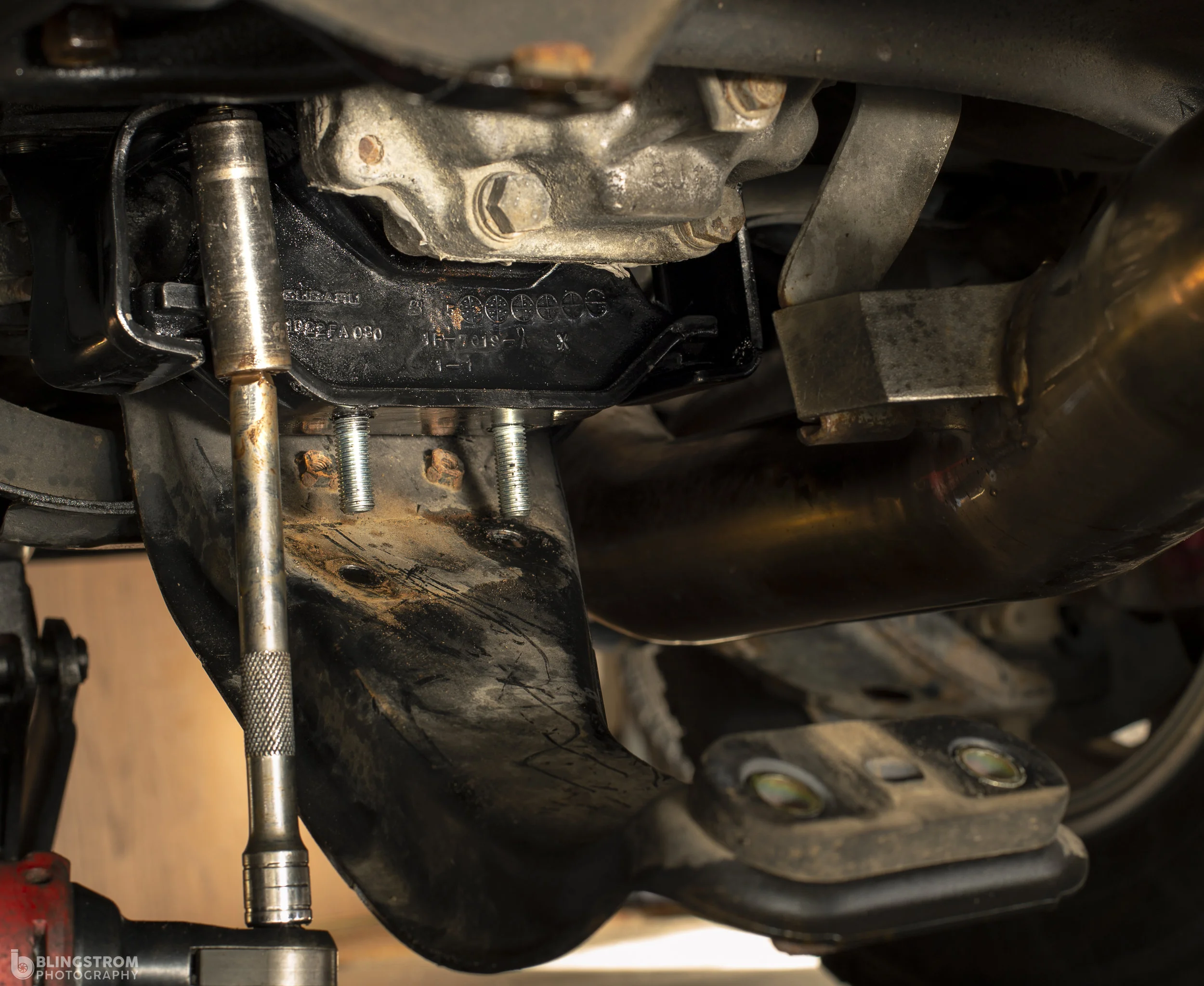 In goes the new boss… With much solidarity. Make sure to leave the bolts a bit loose in order to get the transmission brace back around the studs.