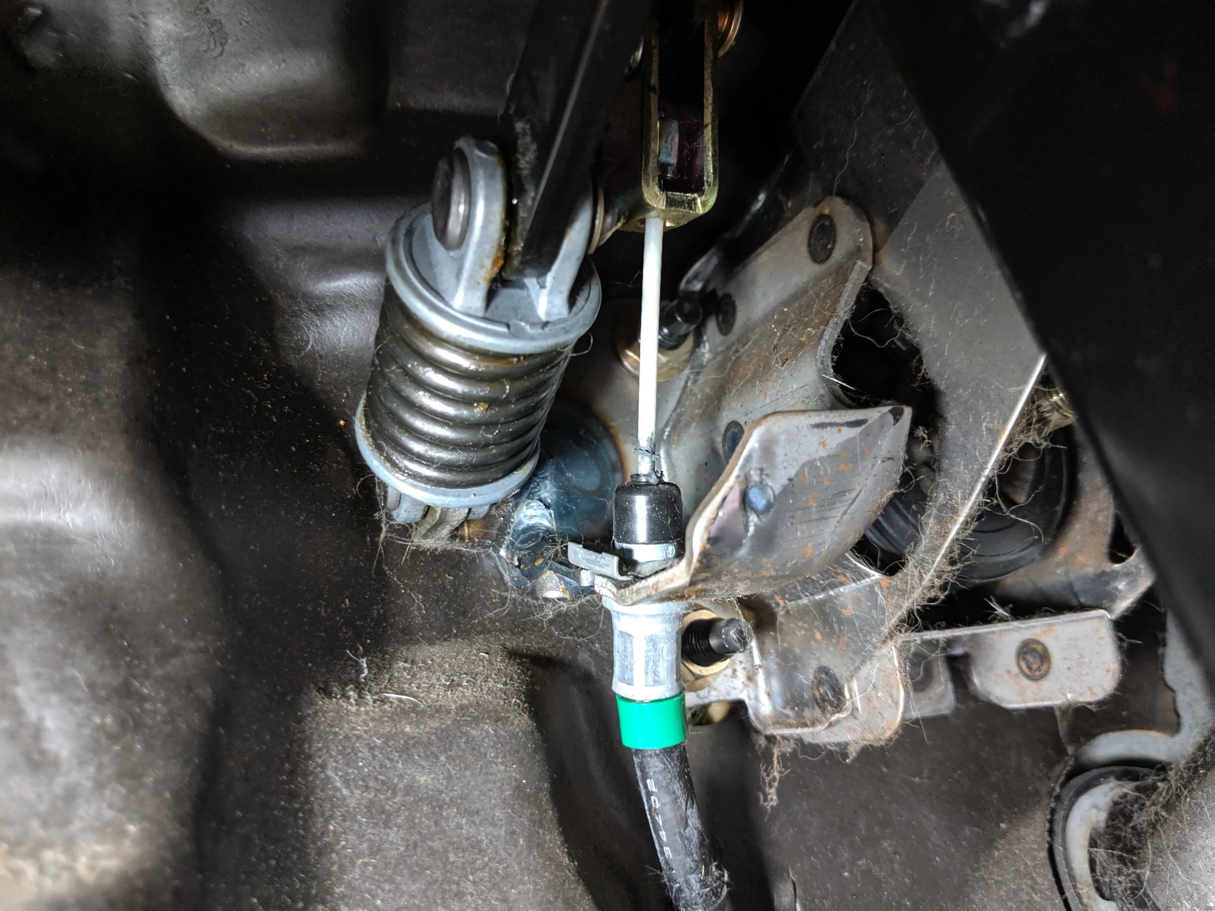 For those looking to complete remove it. You need to remove the clevis pin that holds this cable to the clutch pedal and completely remove the cable from the car.