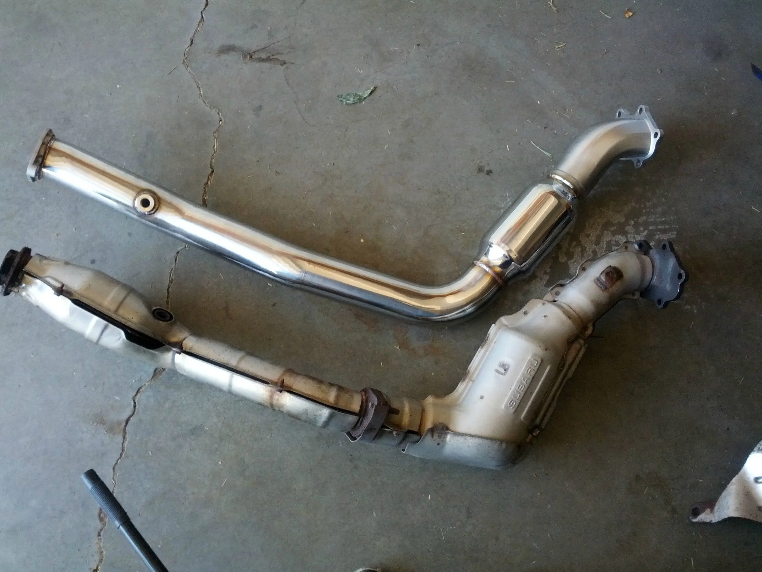 Fancy new downpipe is ready to get put on, but how will you connect your it to your exhaust….