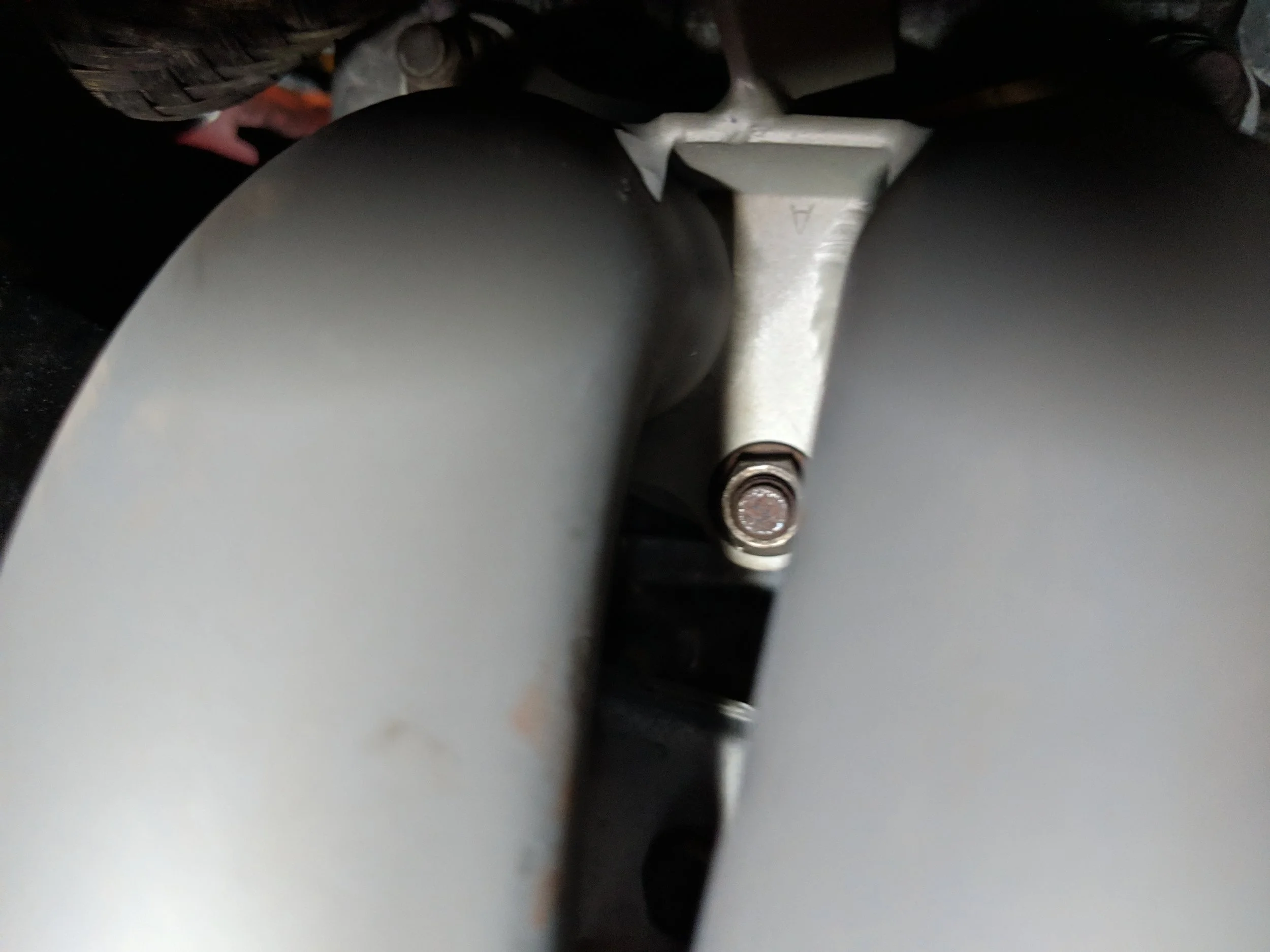 Passenger side nut hiding in between the two runners.