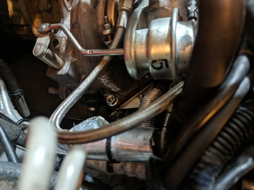 Hand thread the nuts on to the uppipe to hold it in place. Now turn your attention back down to the manifold.