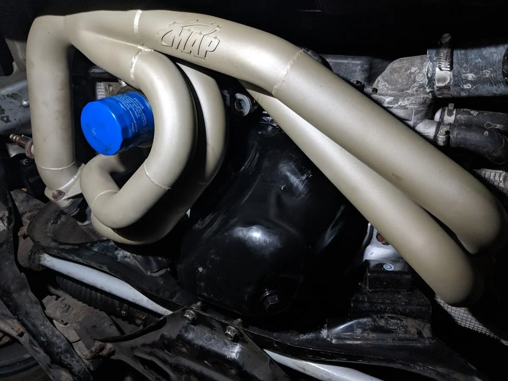 Slide the manifold back up and start to hand thread these nuts.