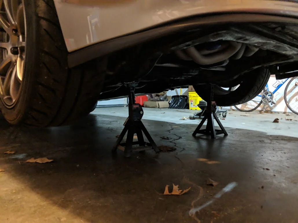Leave it up on your jack stands to double check your connections for leaks. Making sure you are not in closed off room, you need plenty of fresh air to breath when running a car in semi enclosed area. Use fans and all the open doors and windows you can.