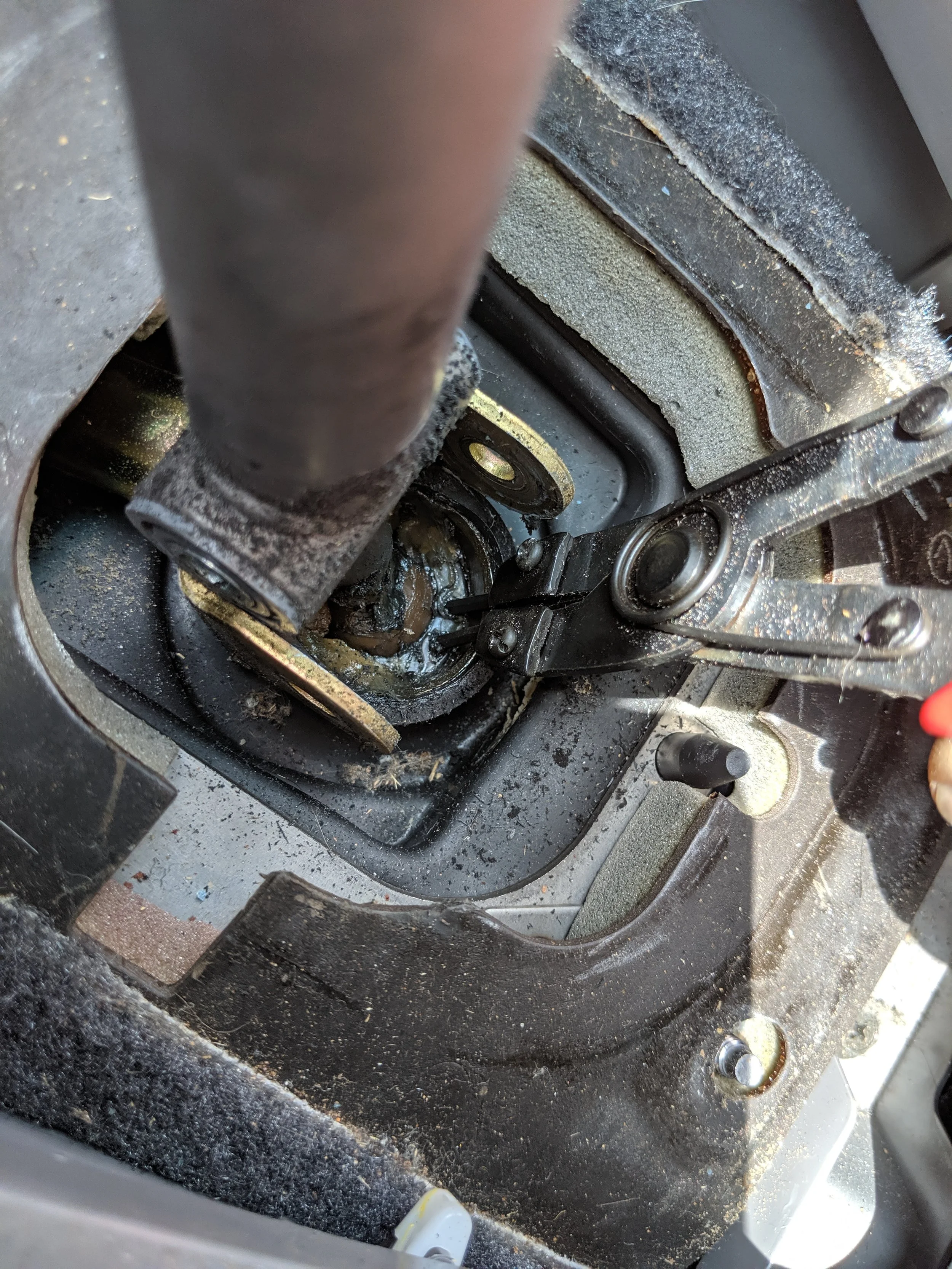 Getting in there and removing the clip. This isn’t the most fun job in the world given the grease on the tool and clip will make this much more difficult.