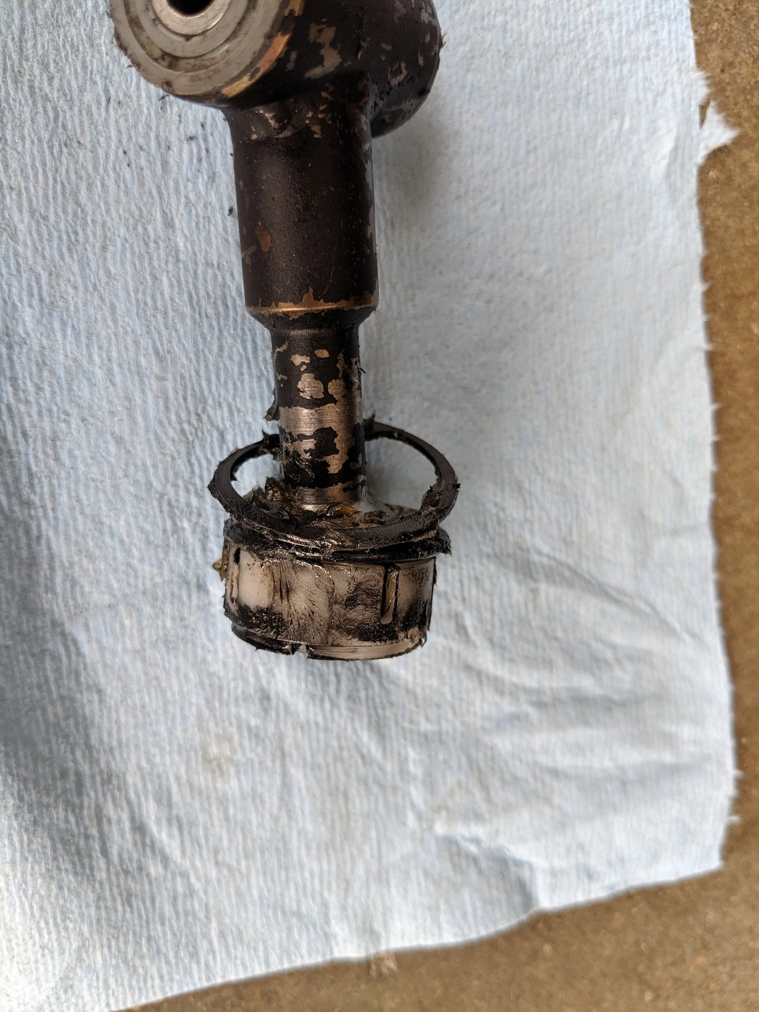 With both the C-clip and plastic cushion replaced we can get ready to put it back into the car.