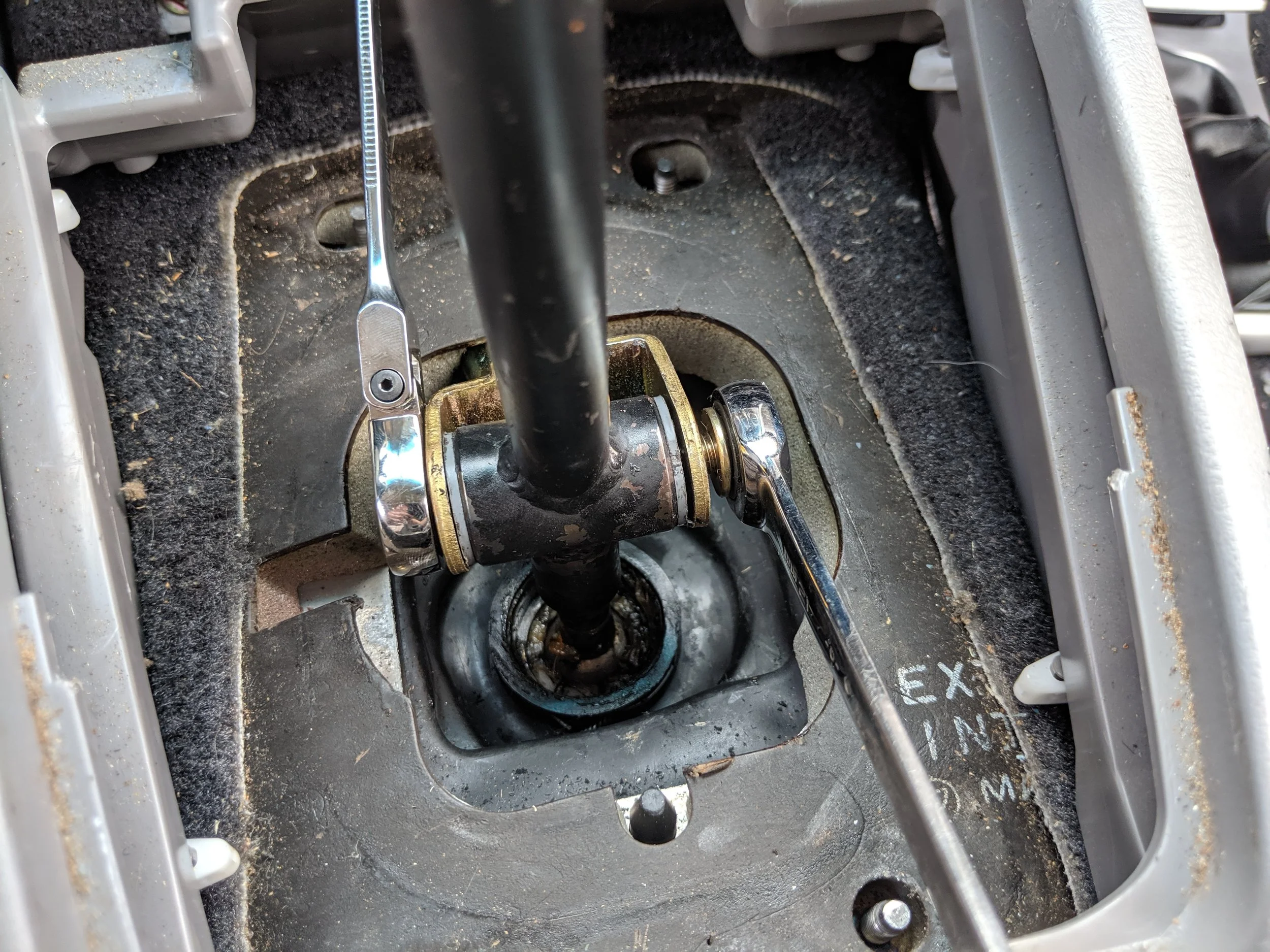 After you get the bolt back through the shifter and linkage take out your trusty 12mm wrenches or sockets and get the nut and bolt ran back down.