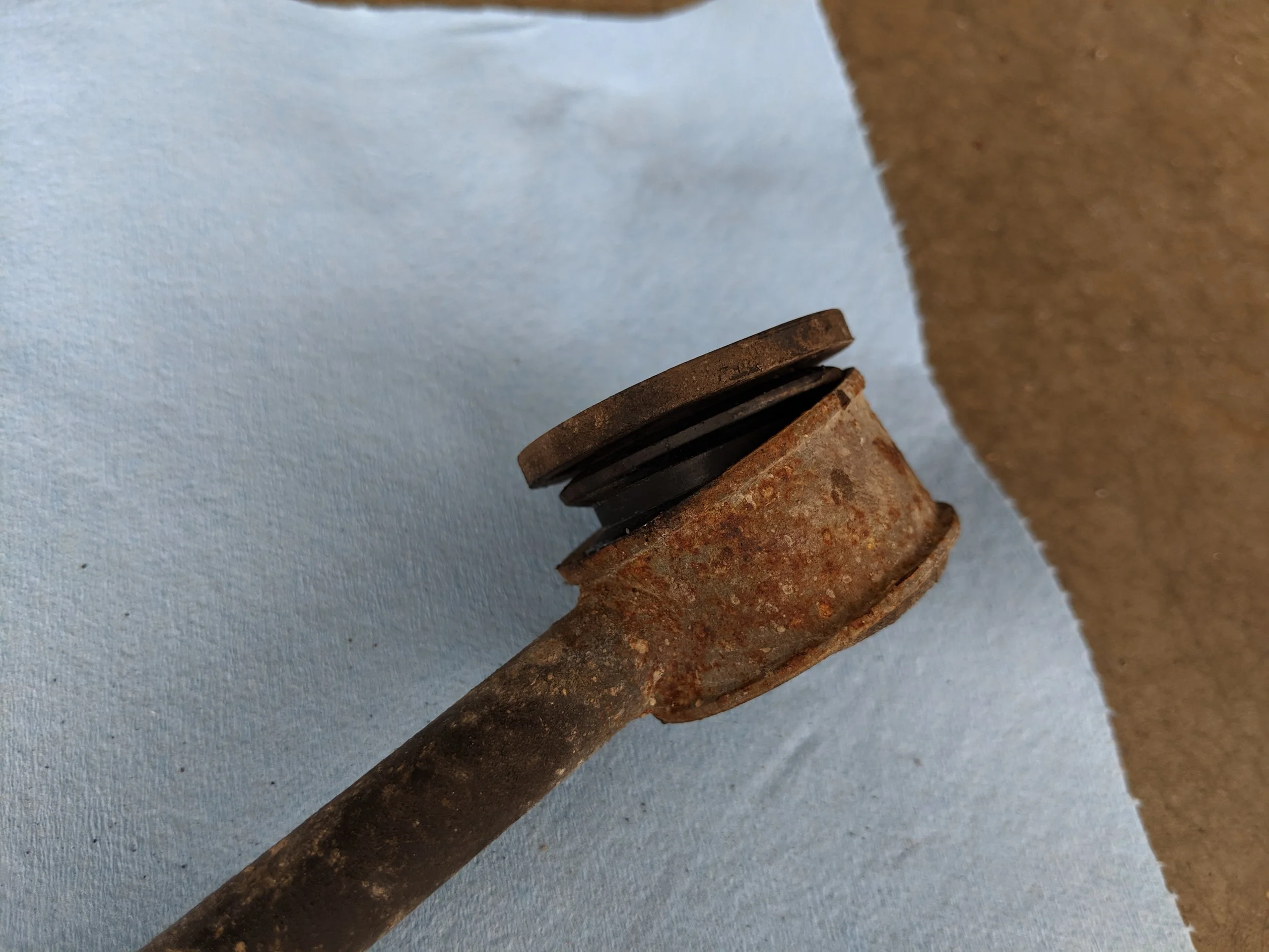 With a flat head screwdriver and a bit of pressure on the side this is what happened. Halfway out without any real effort, used my hands to pop it out the rest of the way.