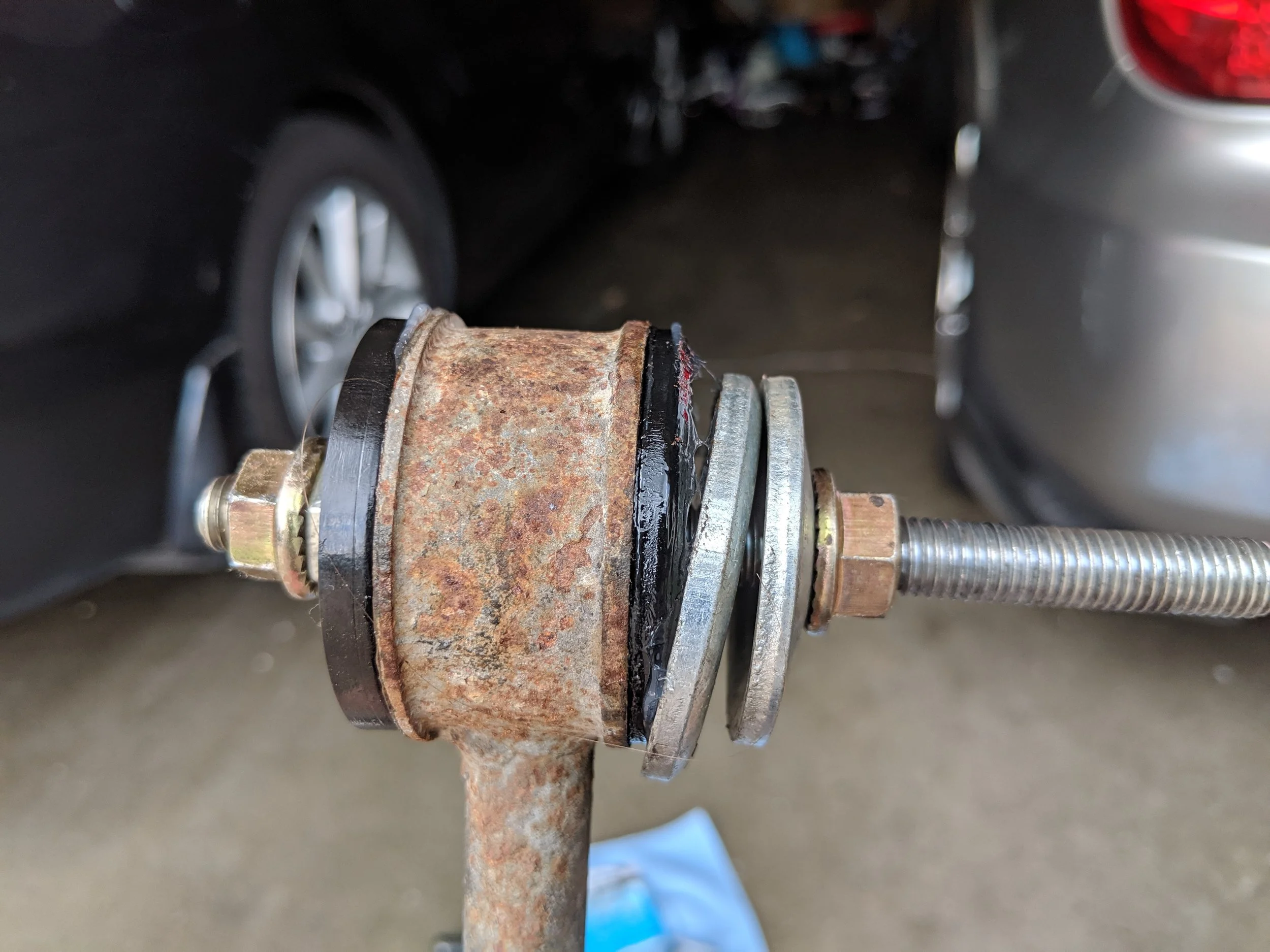 With one nut held with a wrench and one with a ratchet or impact. When you start spinning it down the bushing will slide in and pop into place quickly. With my Milwaukee impact it was to quick job with just two trigger pulls to complete the job.