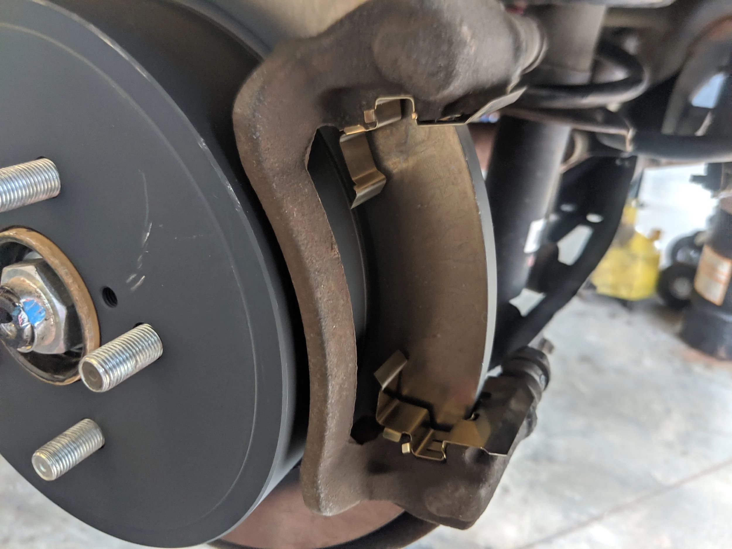 Caliper bracket and hardware ready for their new pads.