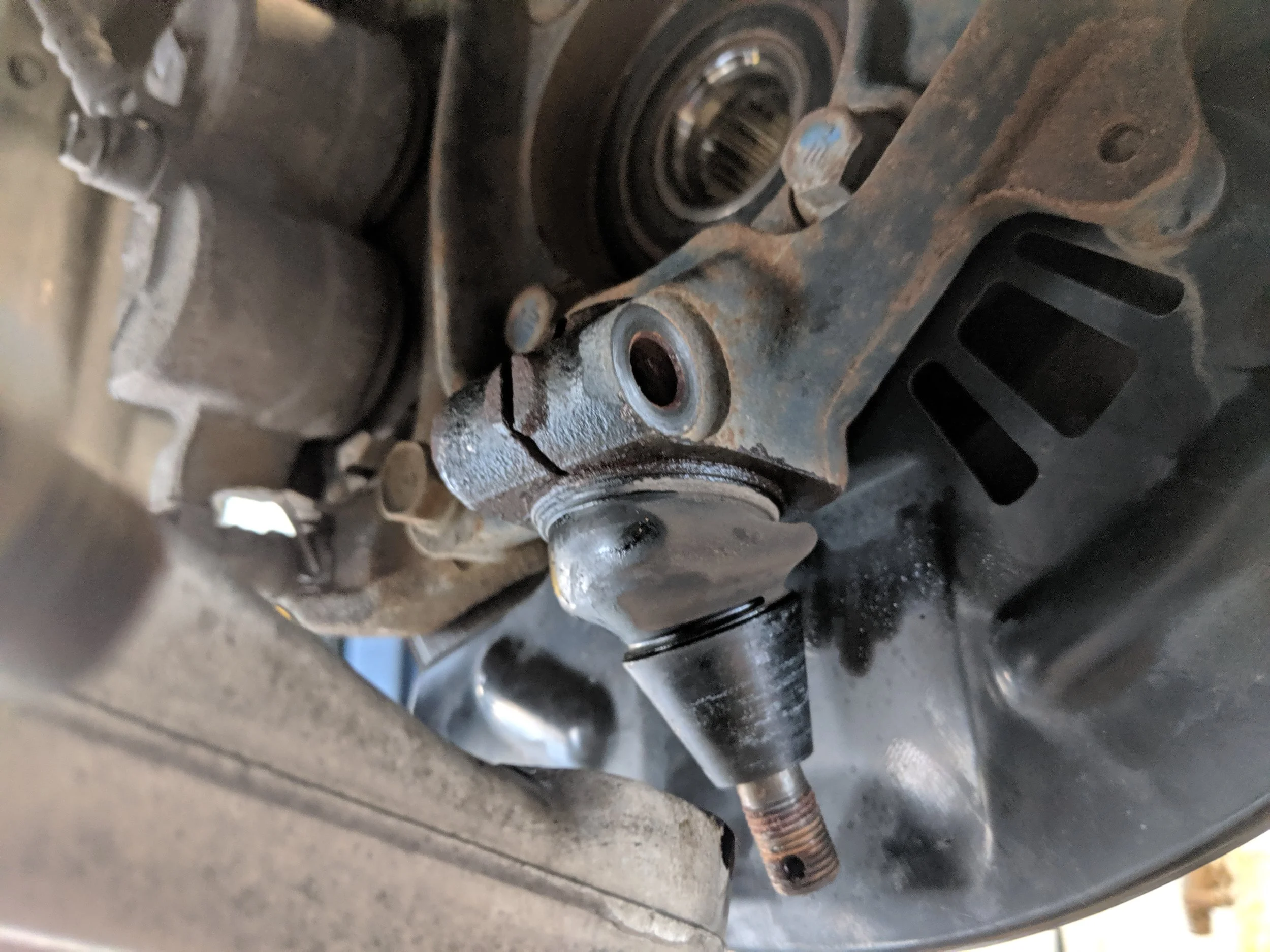 Removing the lower ball joint is the other method to pull the axle shaft out.