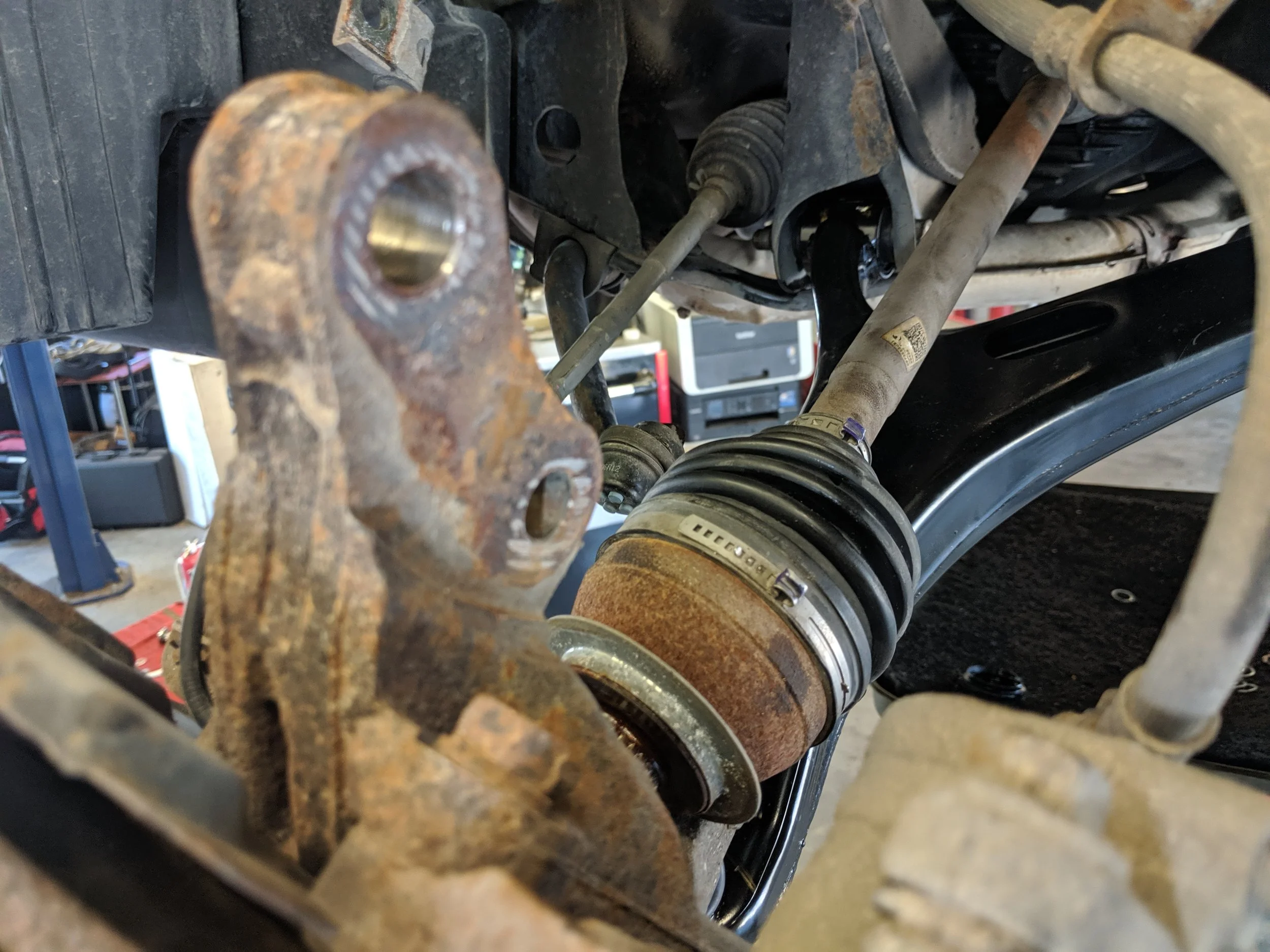 Axle getting ready to be removed as the knuckle is undone.