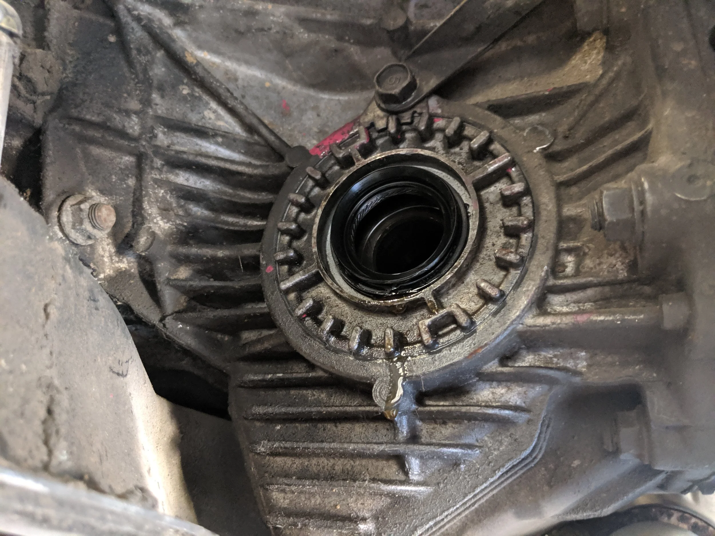 New seal being installed. Run your finger along the edge of the seal to make sure it is evenly installed. Then clean up the area post install to make sure it isn’t leaking again.