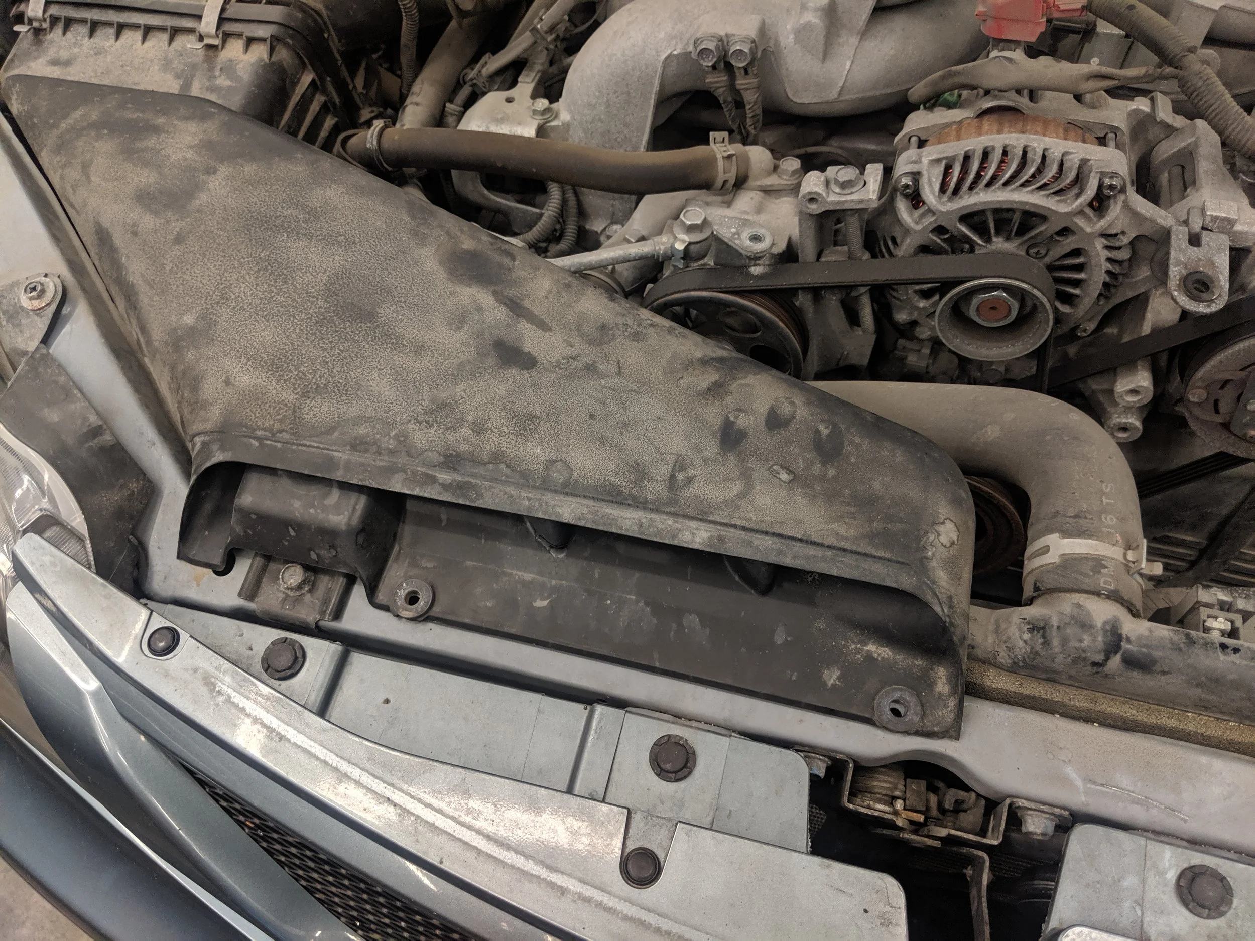 If this duct is on your vehicle, let’s start by removing it to open up some room.