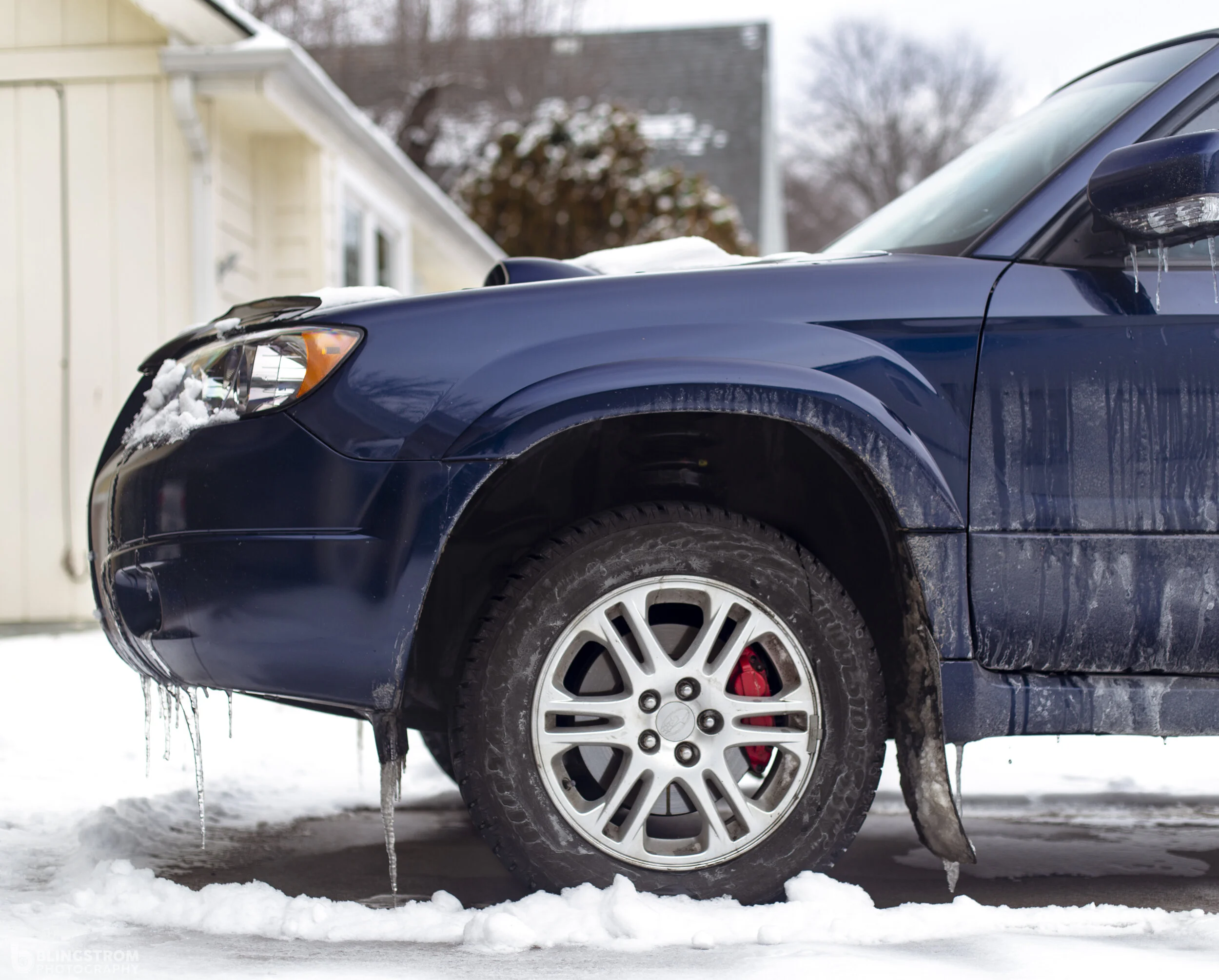 Here is the Forester before the caster mods. You can see how further back the wheel sits in the fender in comparison to the STi above it.