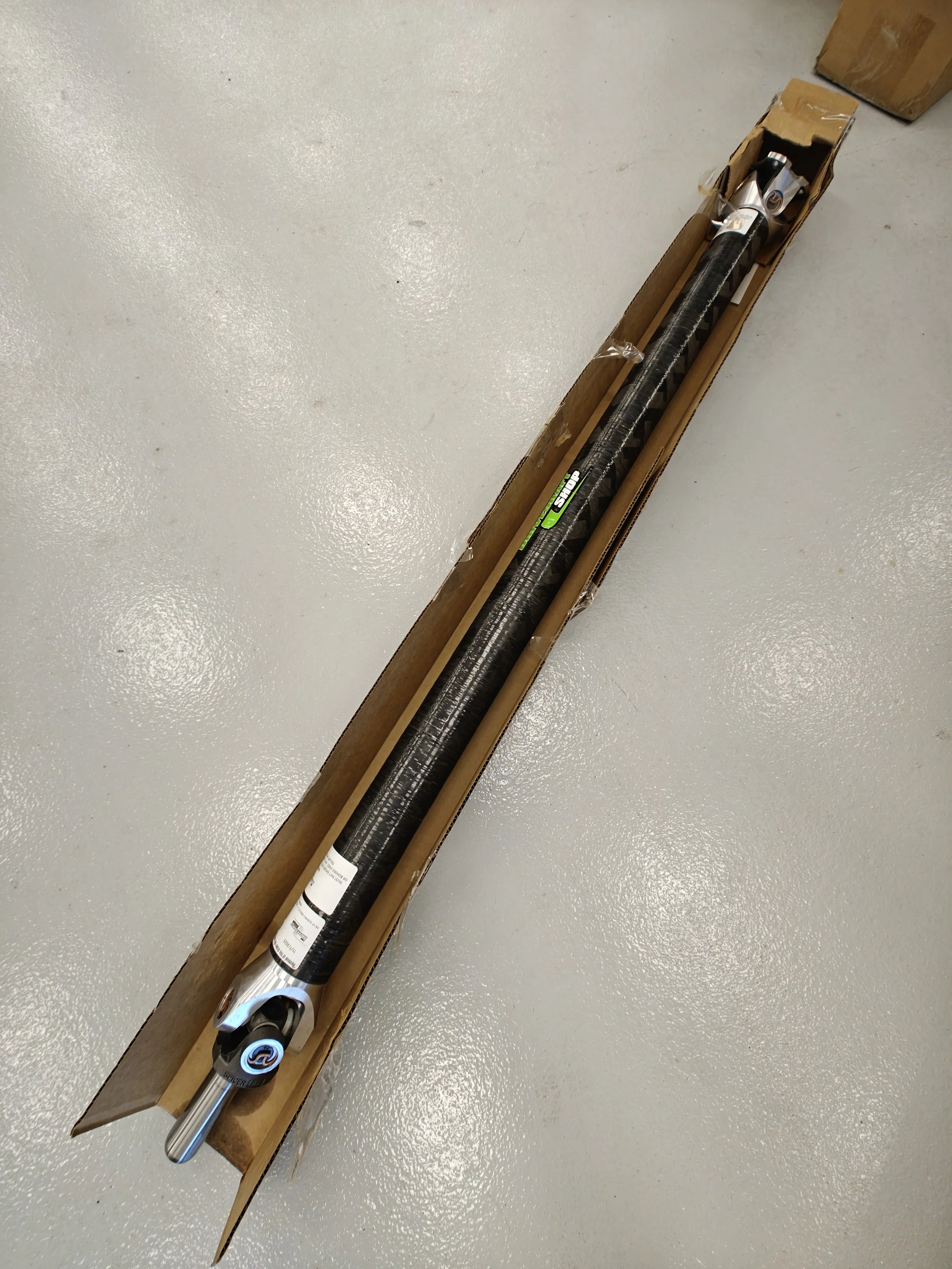 STi carbon fiber driveshaft install! Rid yourself of old u-joints and a bit of weight. 