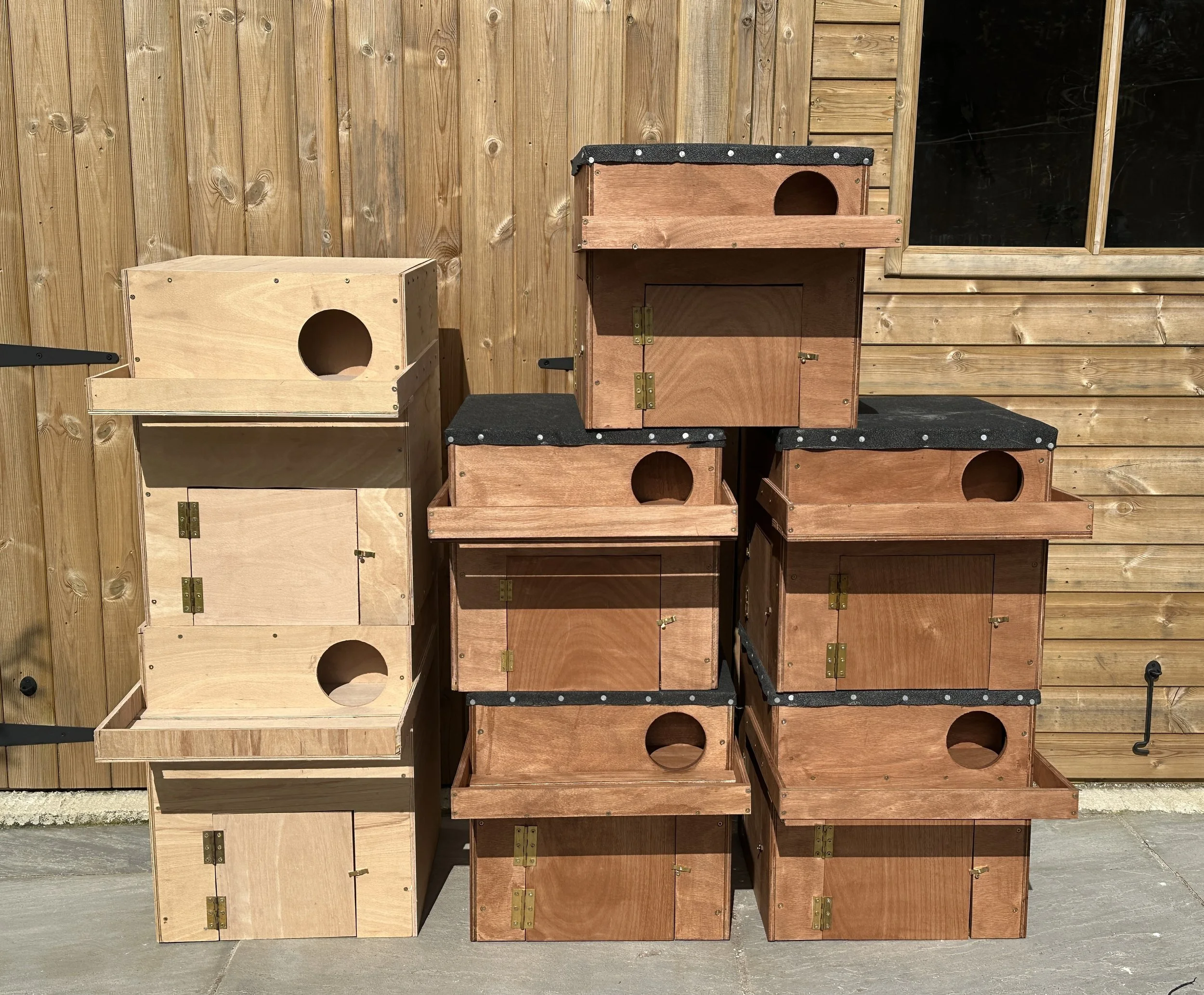 A selection of handcrafted Barn Owl boxes, including designs for both internal and external installation.