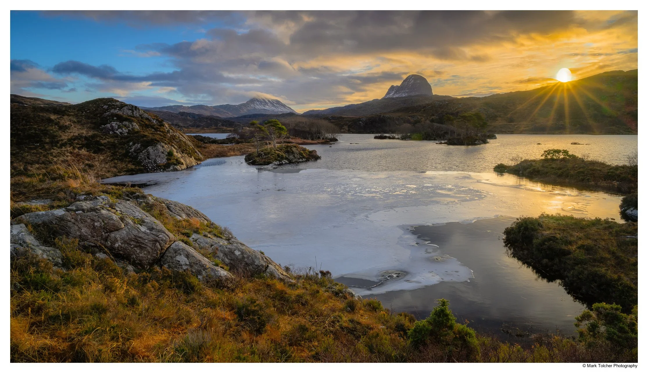Sun Rise over a Partially Frozen Loch