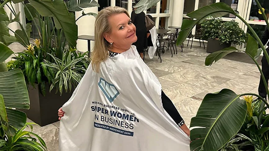 Christi Kelley at the Memphis Botanic Garden showing off her Super Women in Business cape