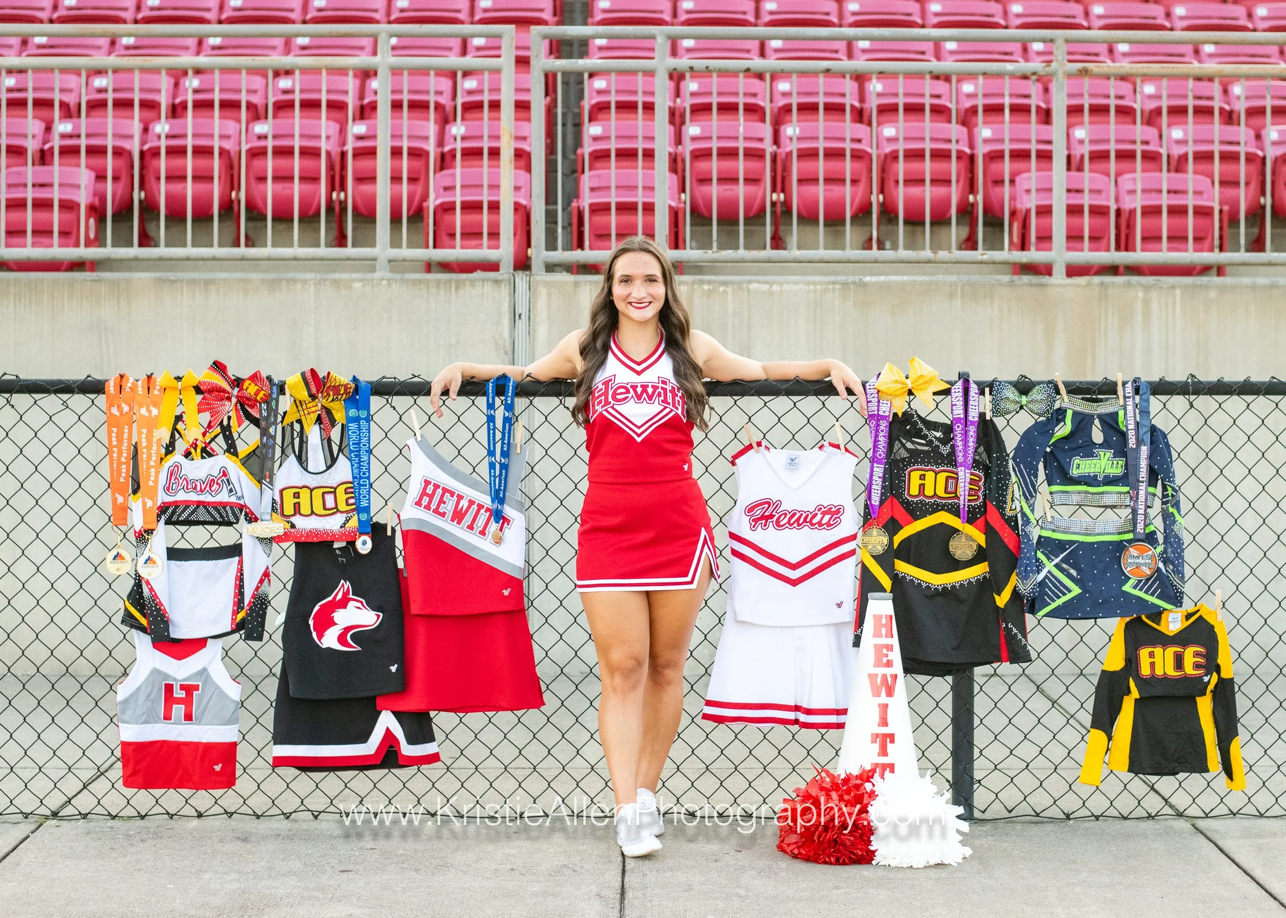 girl standing at husky stadium, cheer pictures Birmingham al, senior photographer near me
