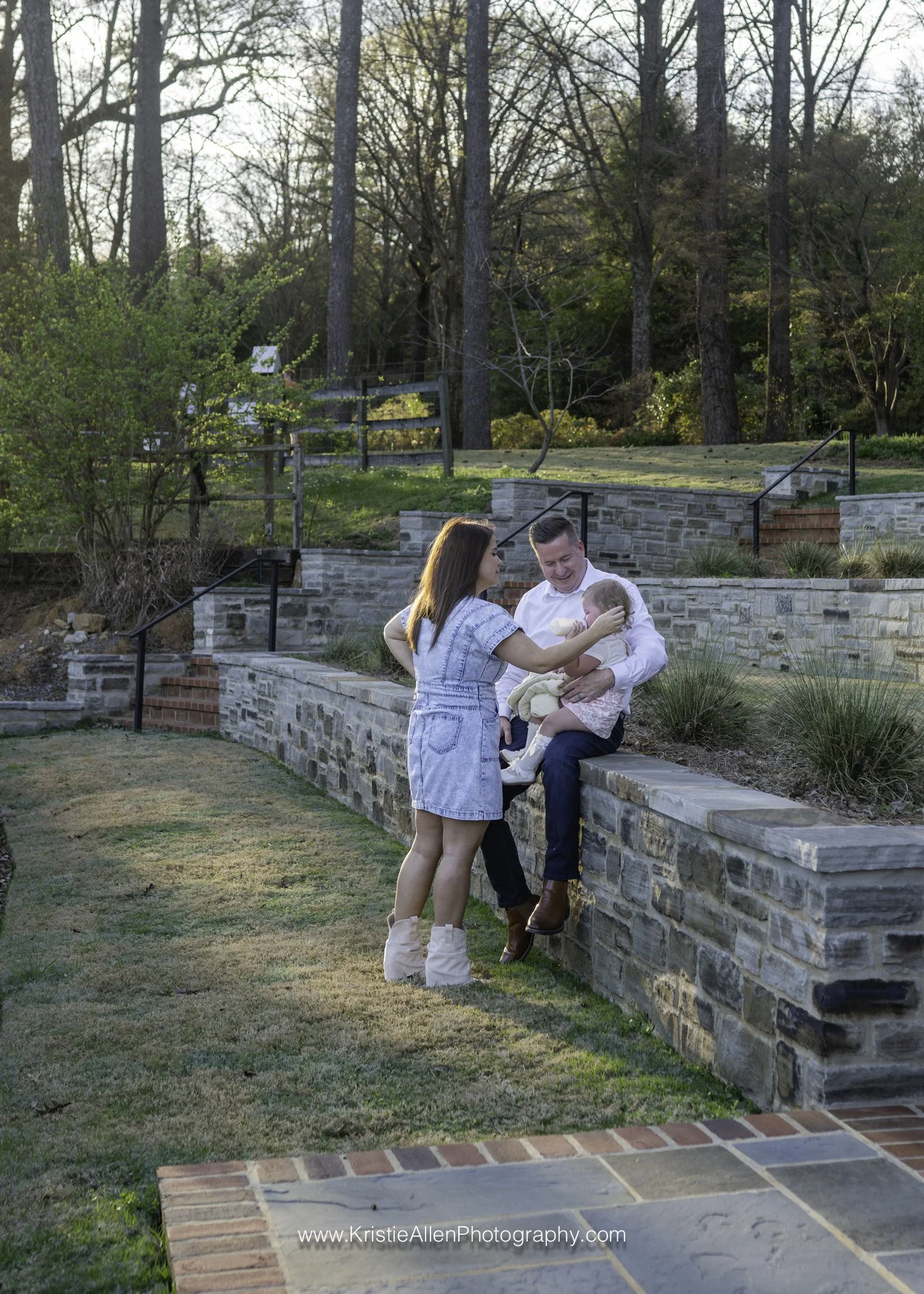 family of 3 taking a break at sunset, family photographer vestavia hills