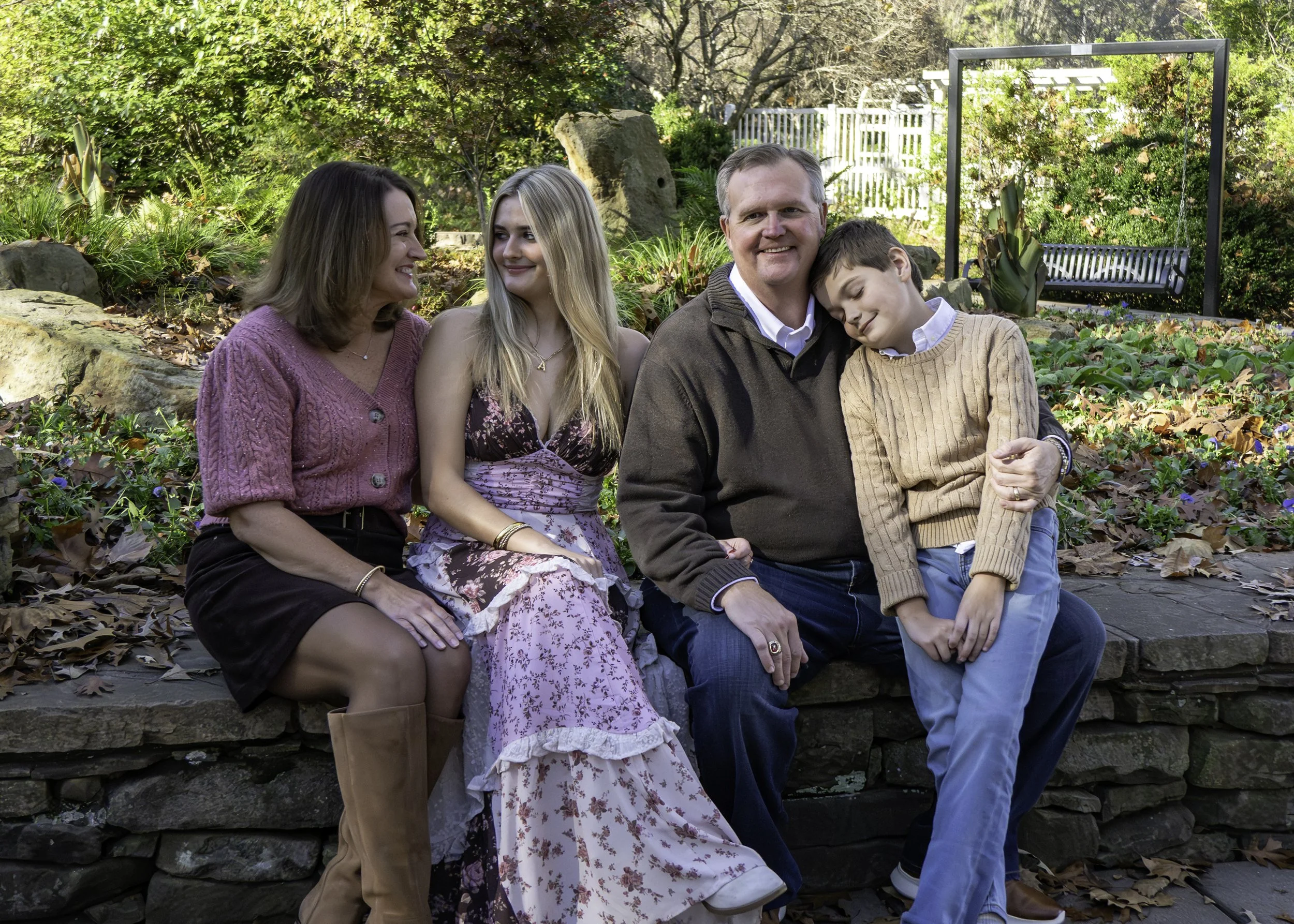 Relaxed family portraits capturing genuine smiles and connection during a fall photography session.