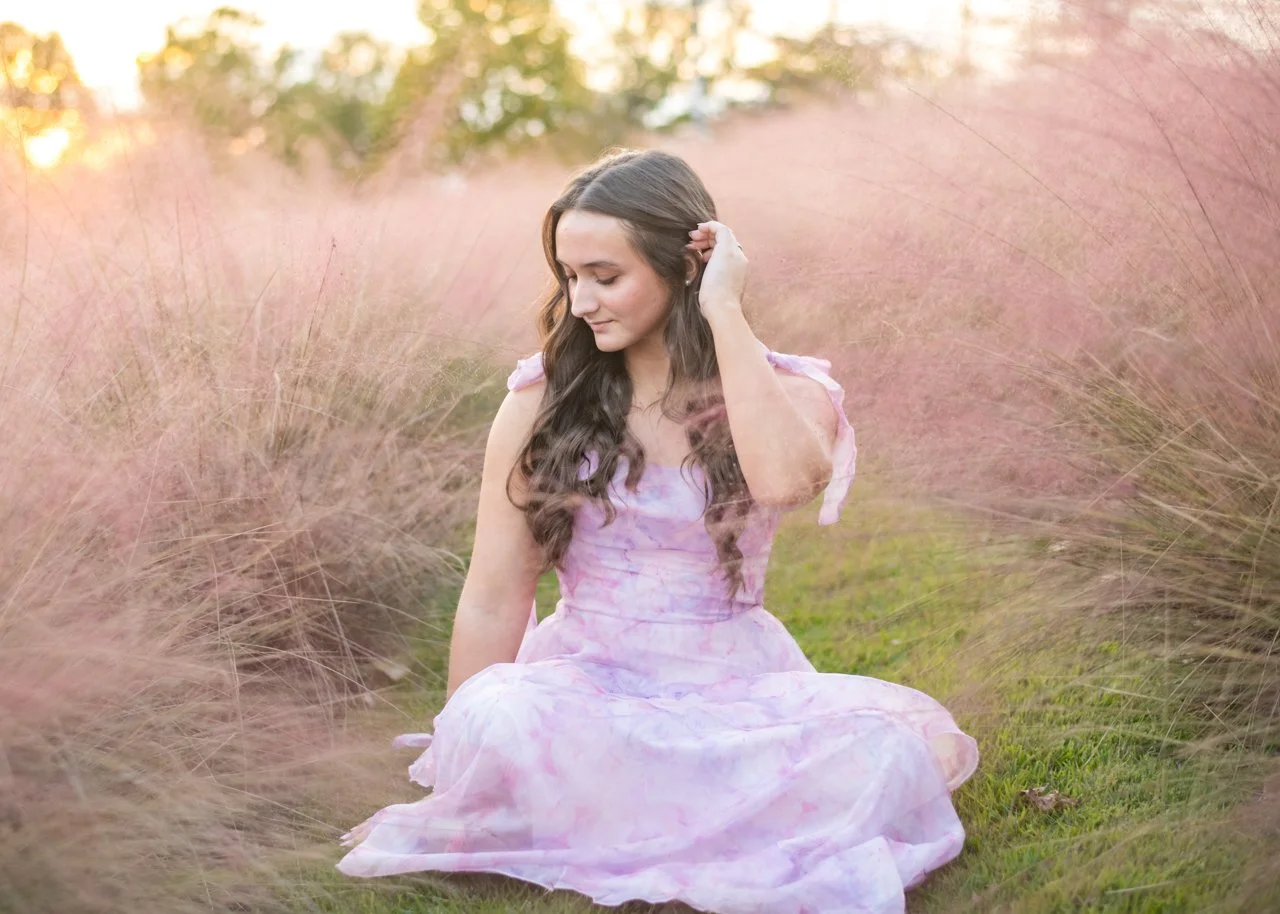 girl sitting at railroad park mountain brook high school senior portraits