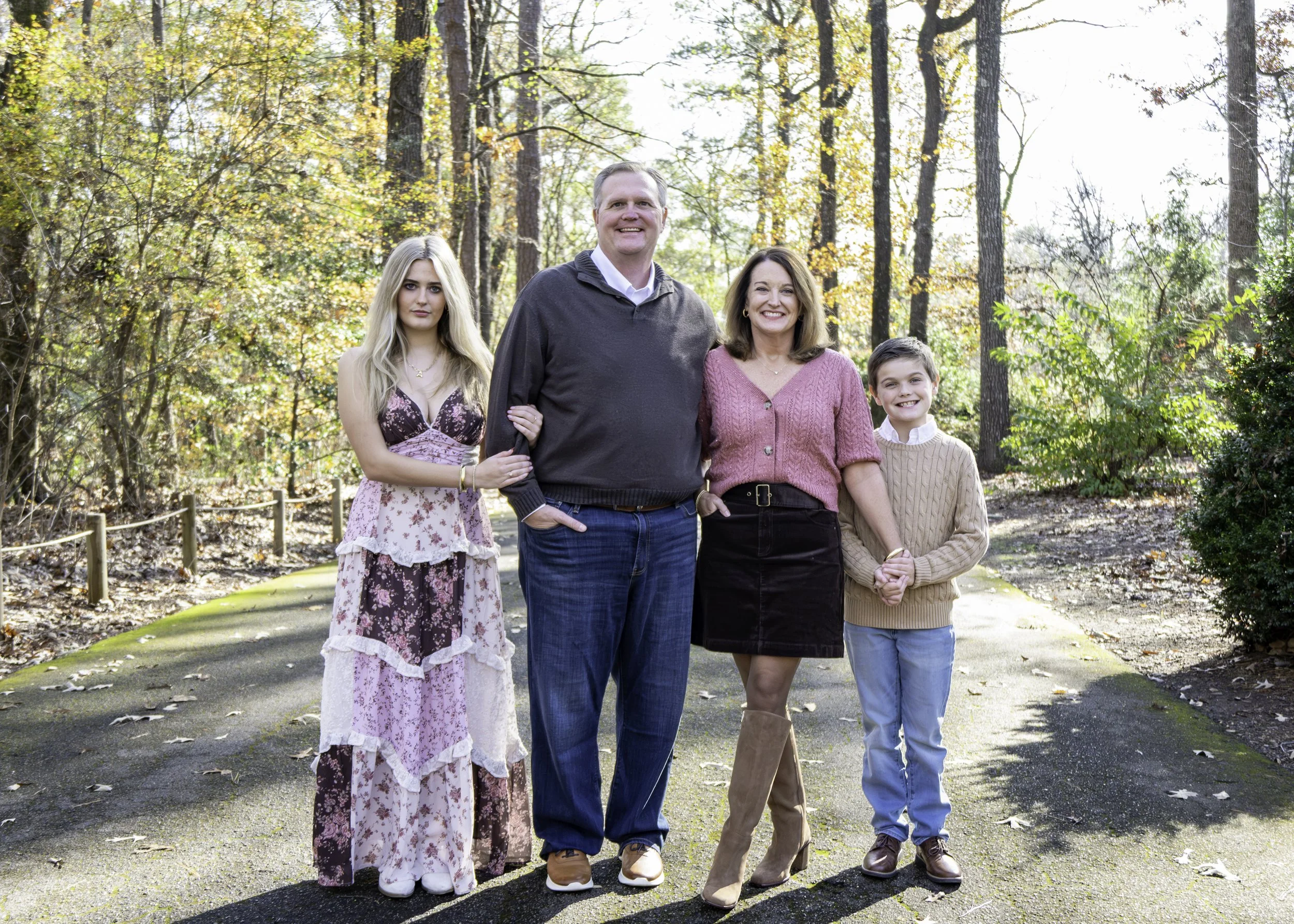 Family standing together during a fall family photography session in Birmingham, AL.