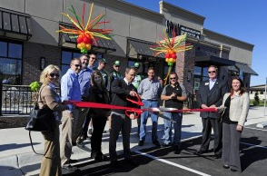 Co-owners Brent and Angie Boles, Brett Klausman and Lee Eaton cut the ribbon on their newest SPIN! Pizza location