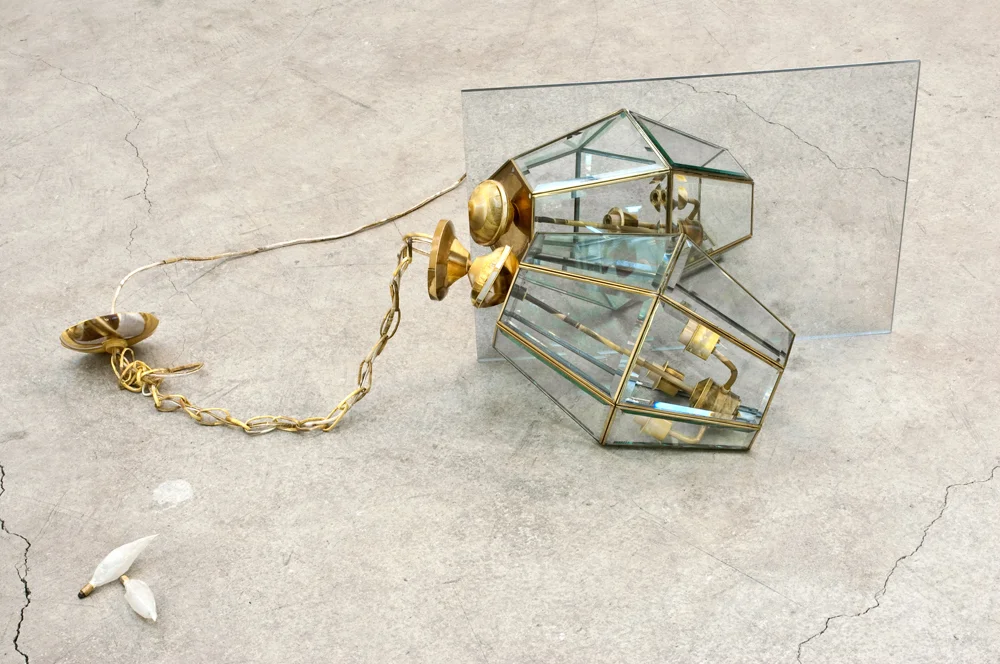 Recinere (Hanging Lamp), 17” x 38” x 25”, pigment print mounted on Plexiglas mirror, glass and metal lamp lens, paper, glue, 2010