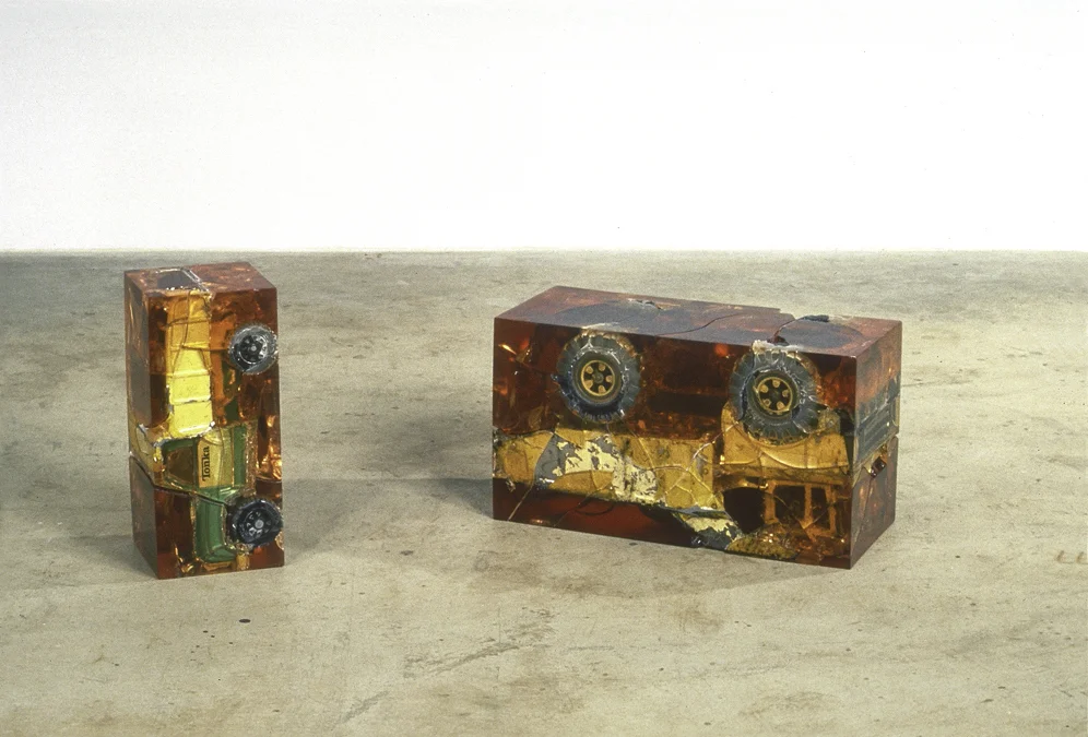Sursum Tonkae (Upended Tonka), 13.5 x 5.75 x 6", resin, toy truck, 1991and Magnus Tonkae (Big Tonka), 10.5 x 18.5. x 7.75”, resin, toy truck, 1991