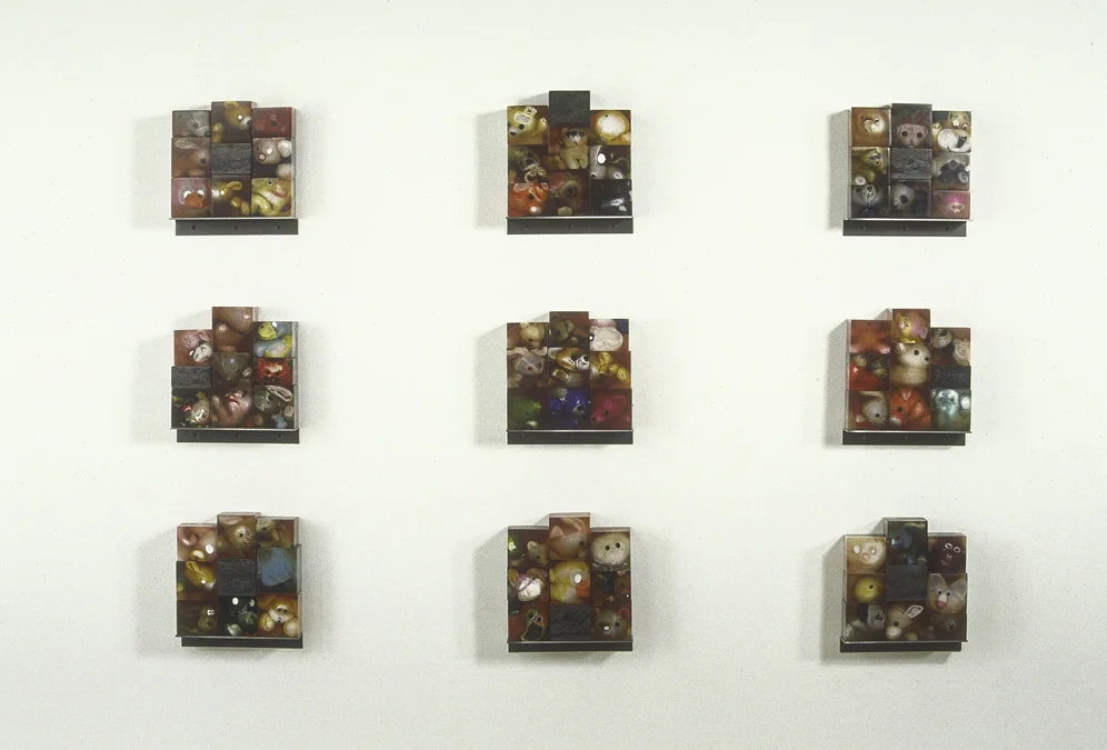 Novenum (Nine Each), 40" x 57" x 3". resin, stuffed animals, steel, 1992