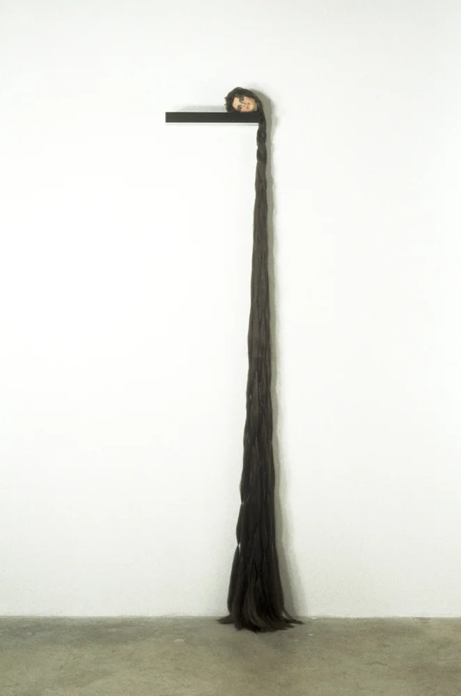 Summa Perfectionis Species (Brooke), 88" x 16" x 7", steel, doll head, synthetic hair, thread, 1993