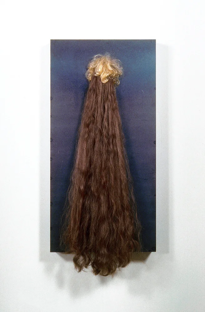 Desiderium (Two Heads of Hair), 34" x 15" x 4", steel, doll, synthetic hair, thread, 1995