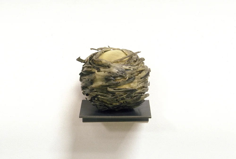 Pila Pennatum (Feathered Ball), 4.5 x 4.5 x 4.5", steel, softball, feathers, wax, 1989