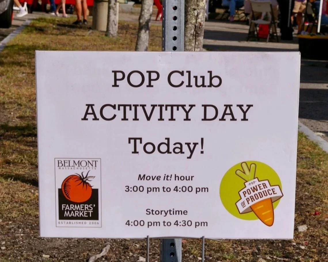 A sign that says "POP Club ACTIVITY DAY Today!"