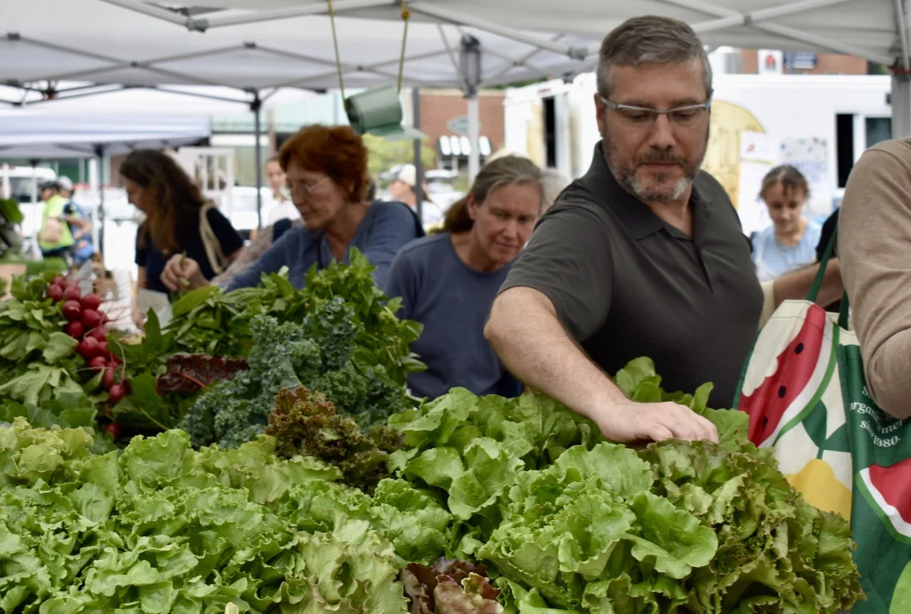 People selecting greens